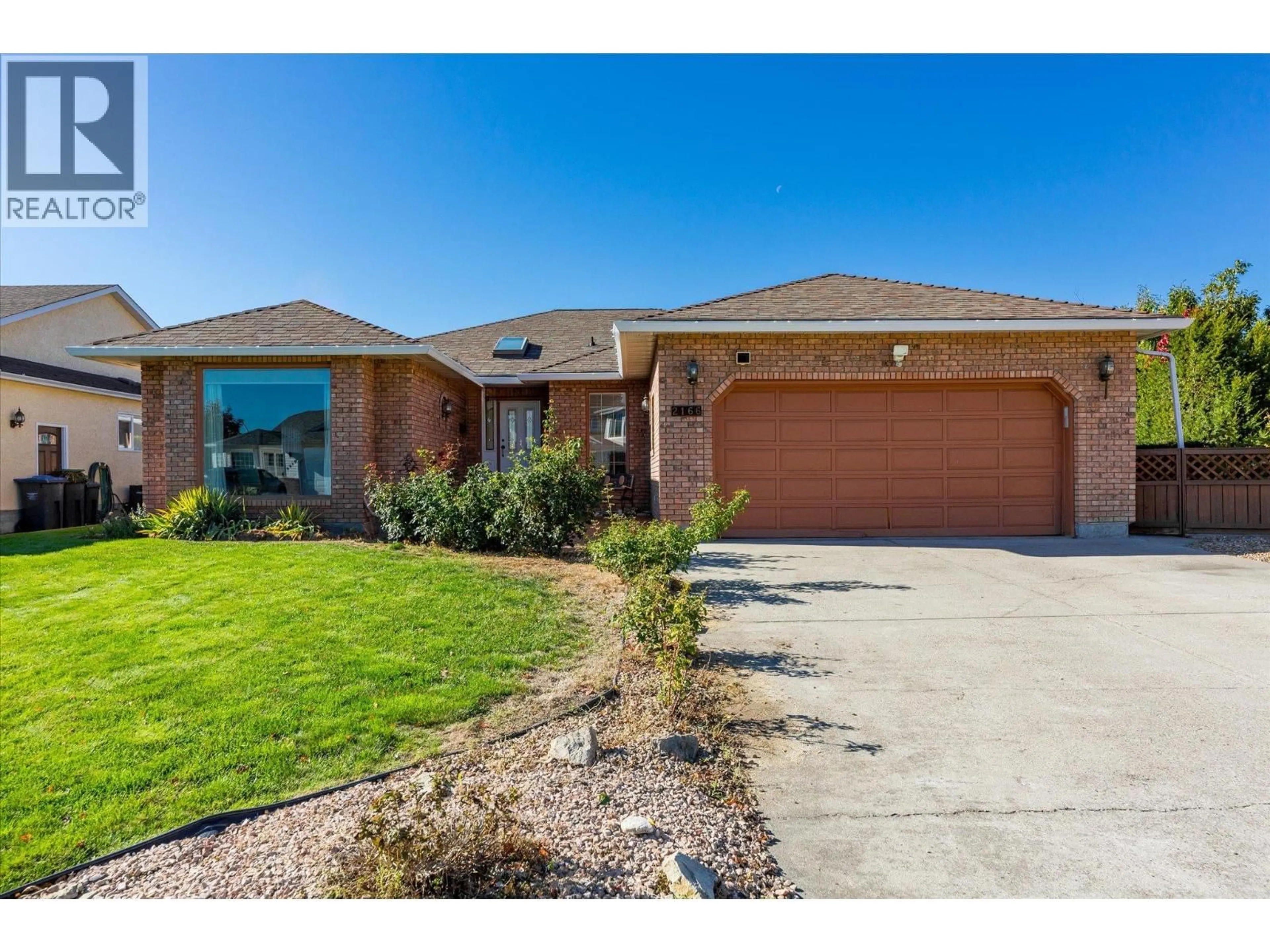 Home with brick exterior material, street for 2166 KASLO COURT, Kelowna British Columbia V1Y8C1