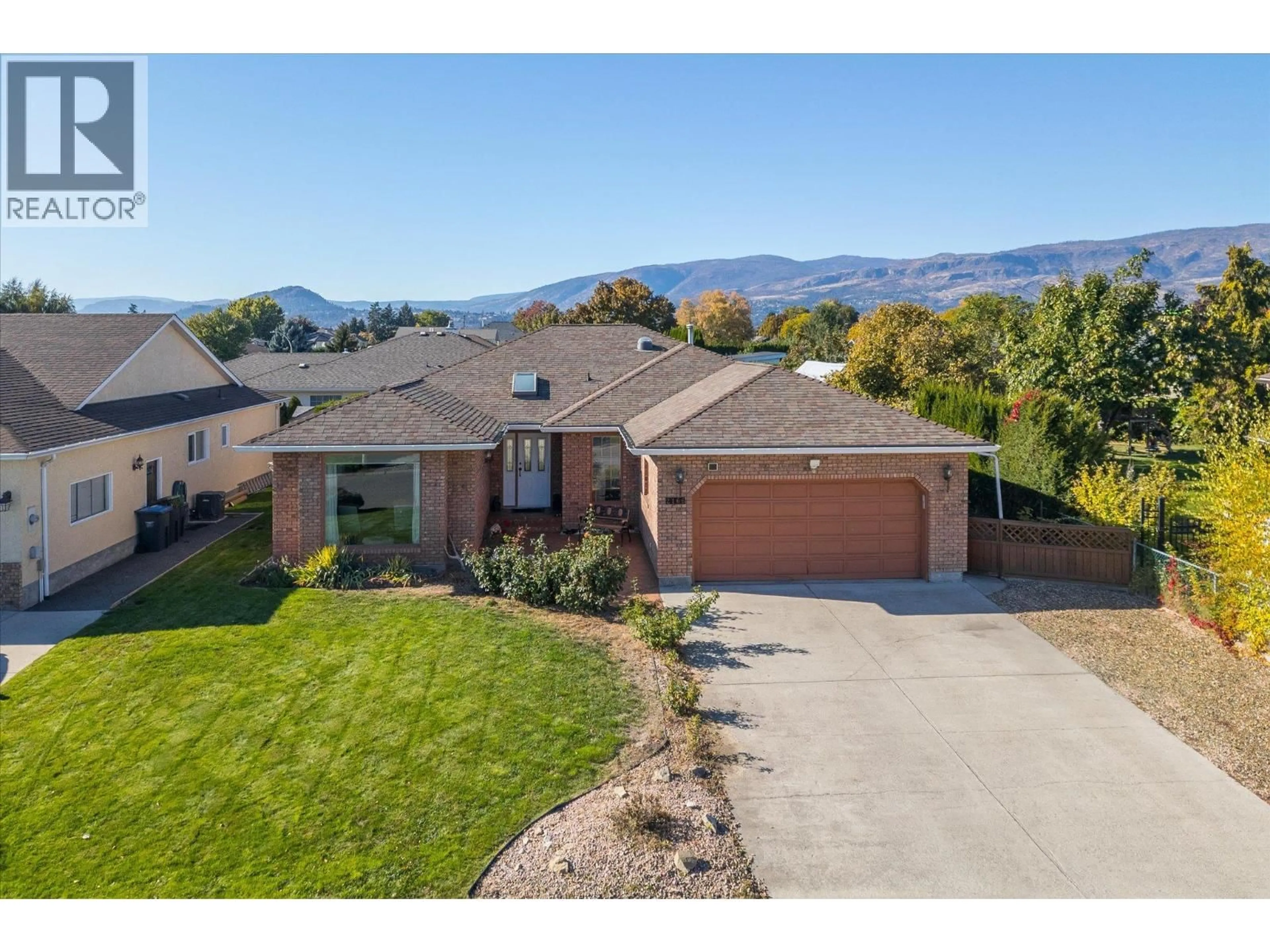 A pic from outside/outdoor area/front of a property/back of a property/a pic from drone, mountain view for 2166 KASLO COURT, Kelowna British Columbia V1Y8C1