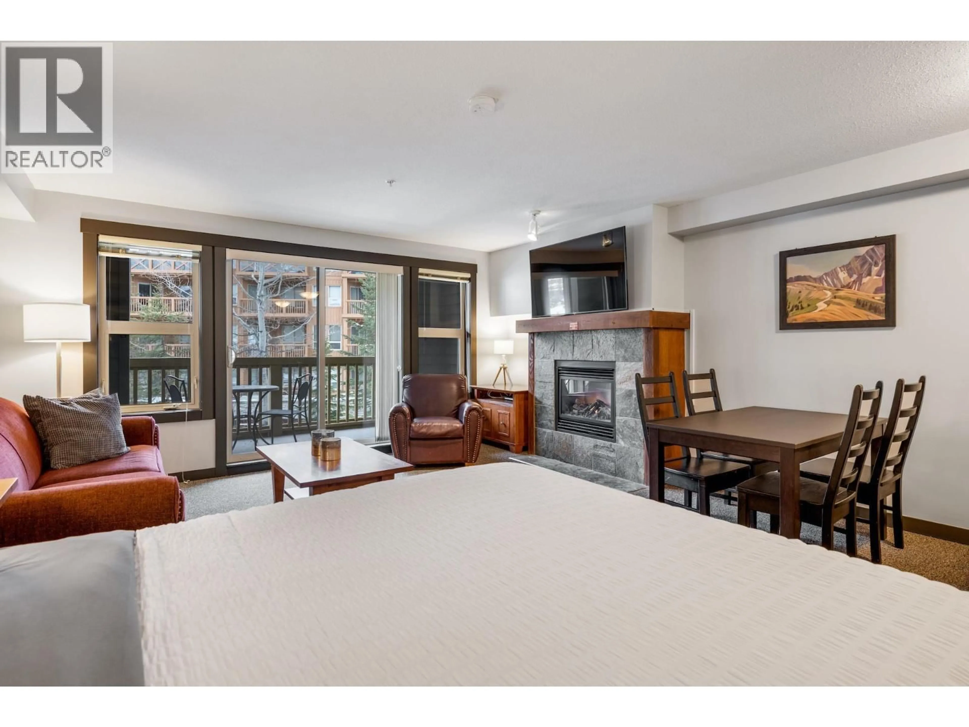 Living room with furniture, wood/laminate floor for 201B - 2070 SUMMIT DRIVE, Panorama British Columbia V0A1T0