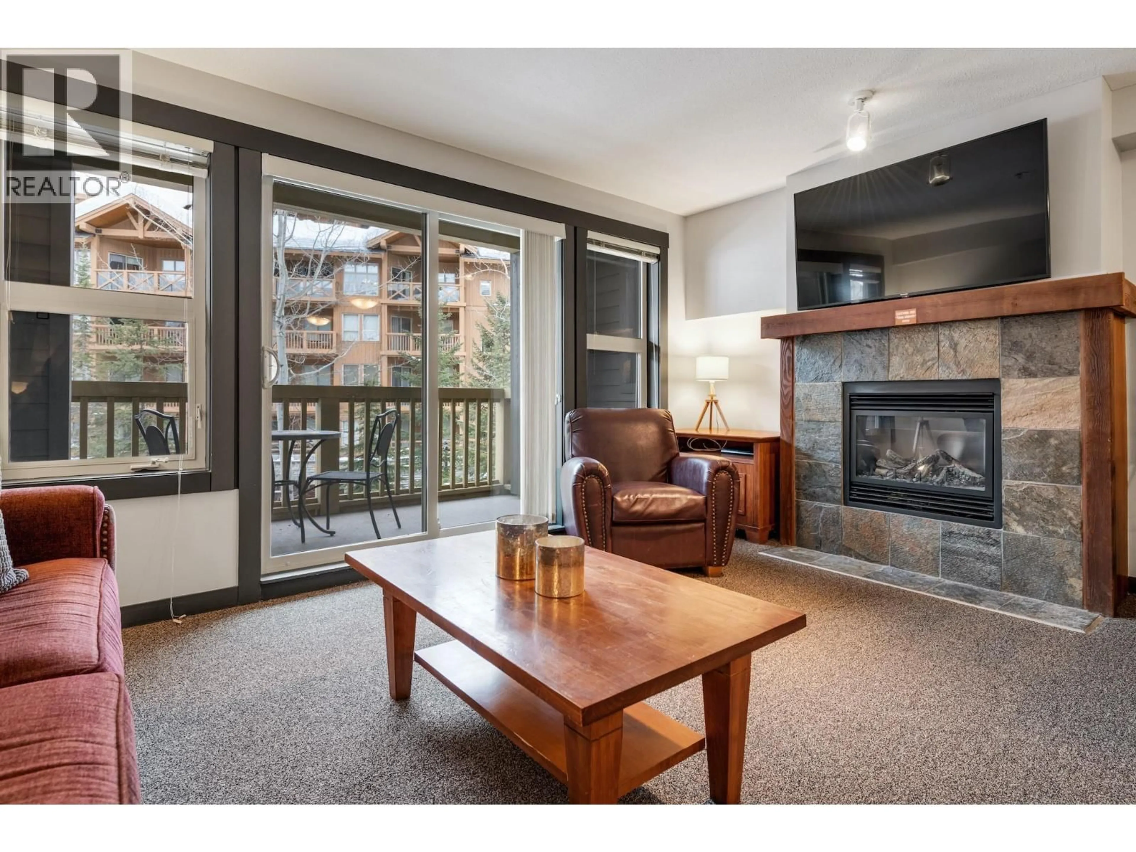 Living room with furniture, wood/laminate floor for 201B - 2070 SUMMIT DRIVE, Panorama British Columbia V0A1T0