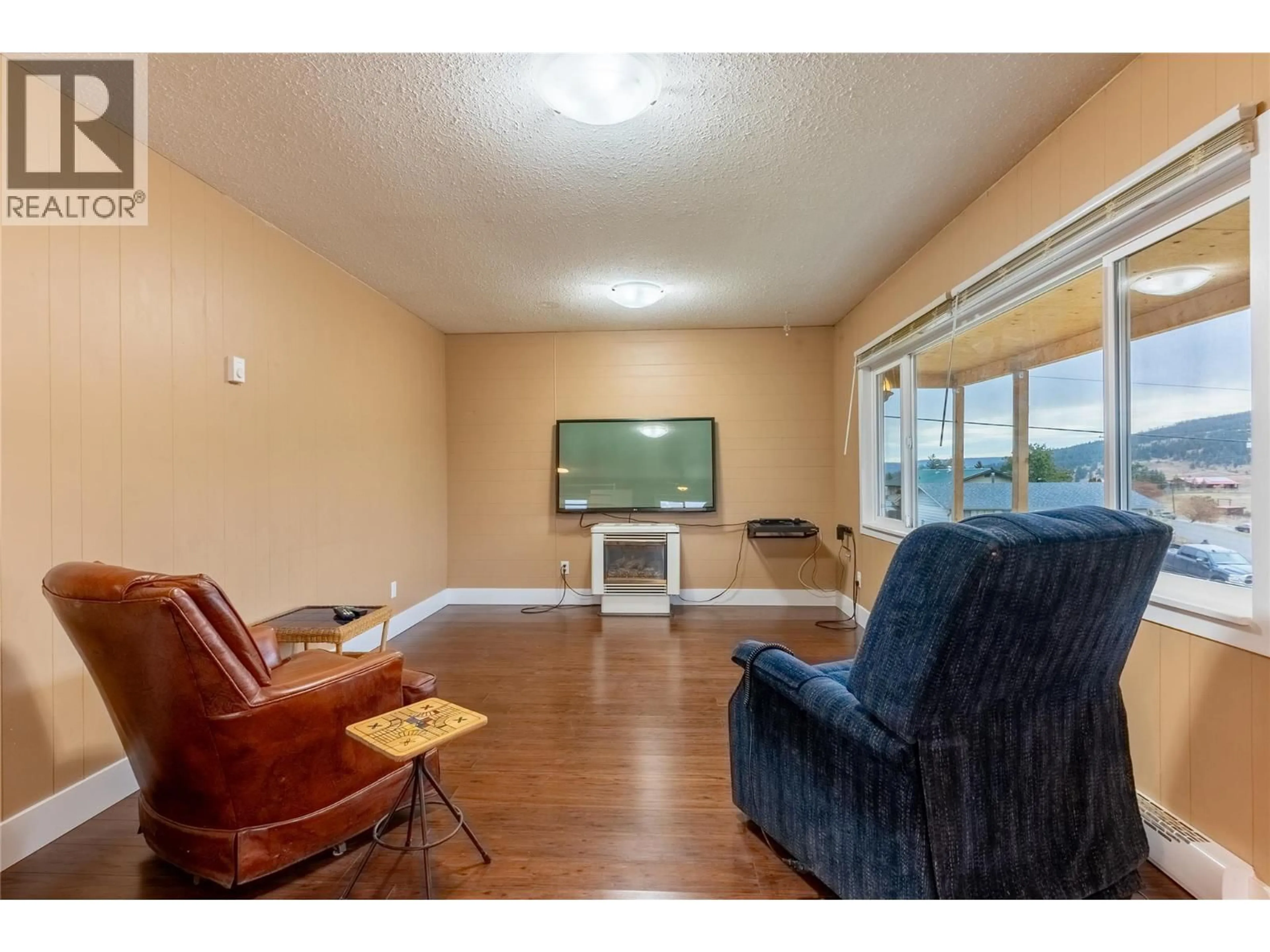 Living room with furniture, wood/laminate floor for 1722 FRONTAGE ROAD, Clinton British Columbia V0K1K0