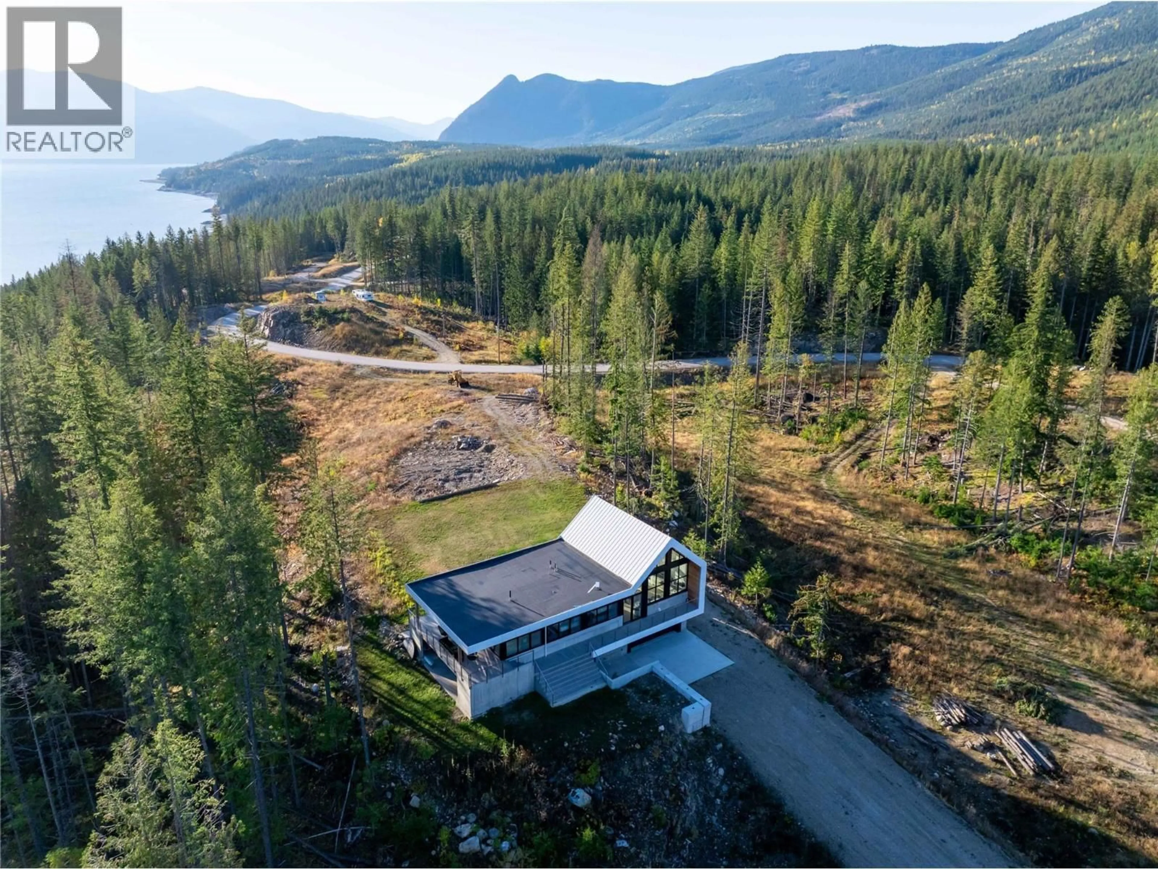 A pic from outside/outdoor area/front of a property/back of a property/a pic from drone, water/lake/river/ocean view for 1950 SIDMOUTH ROAD, Revelstoke British Columbia V0E2S0