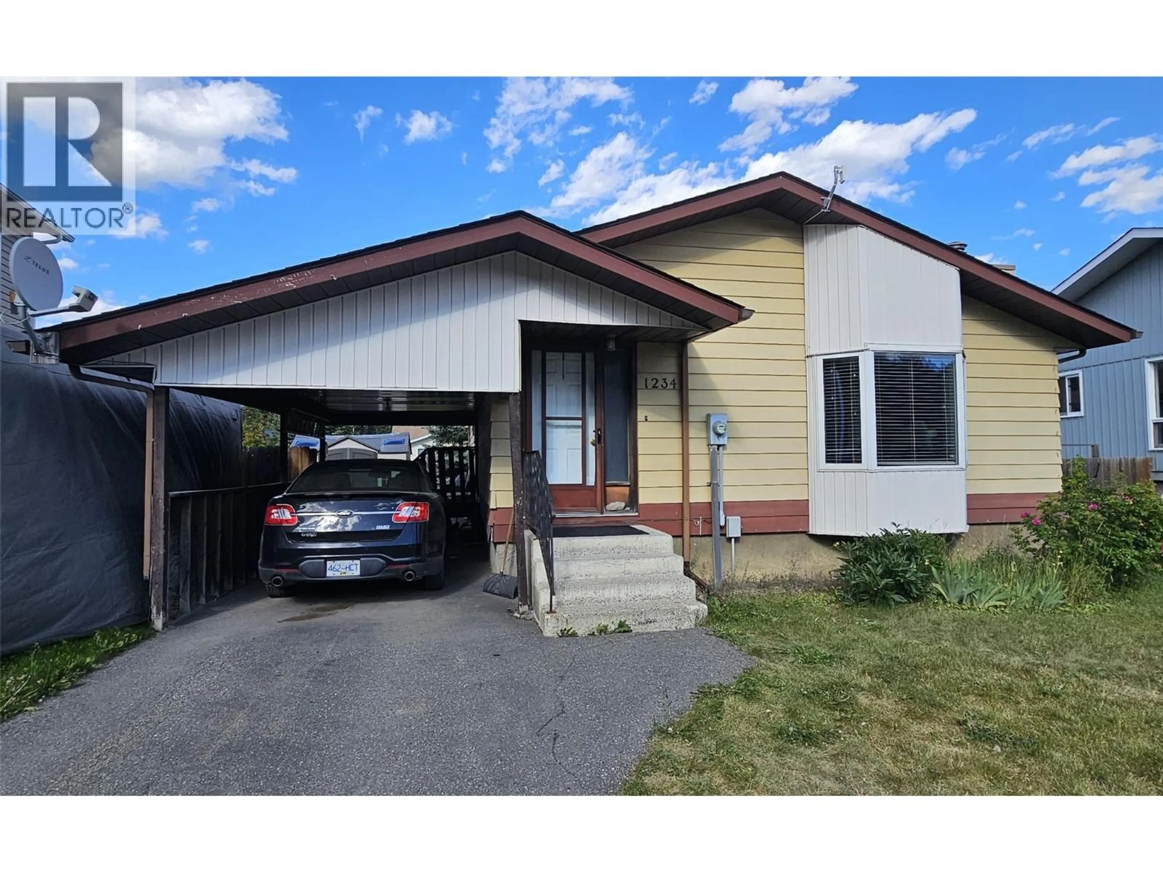 Home with vinyl exterior material, street for 1234 HICKORY CRESCENT, Sparwood British Columbia V0B2G2