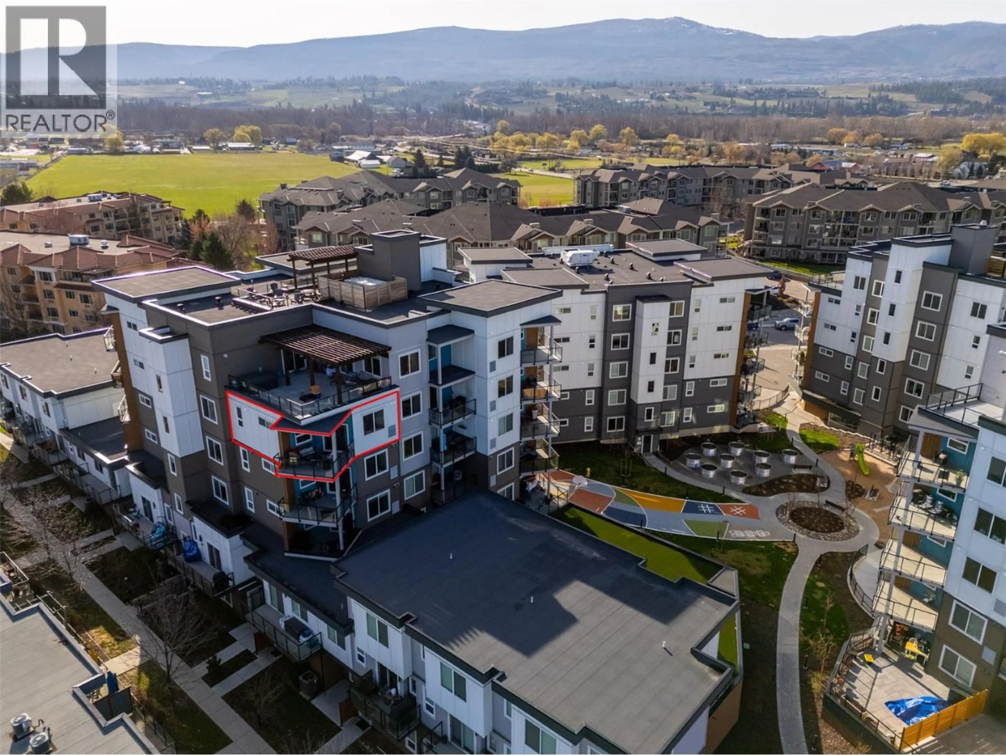 A pic from outside/outdoor area/front of a property/back of a property/a pic from drone, mountain view for 506 - 3630 MISSION SPRINGS DRIVE, Kelowna British Columbia V1W0B2