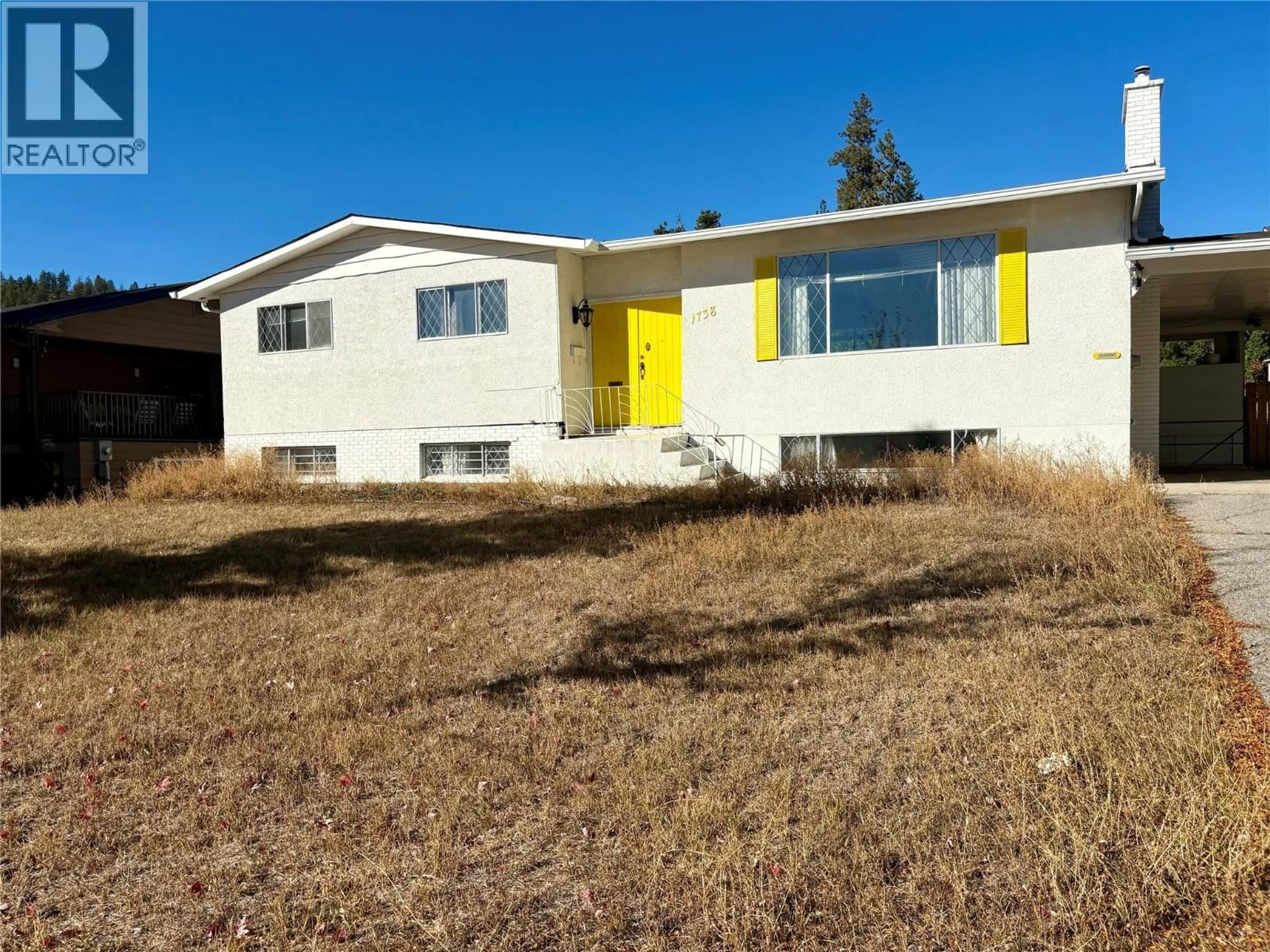 Home with vinyl exterior material, street for 1738 SMITHSON DRIVE, Kelowna British Columbia V1Y4E3