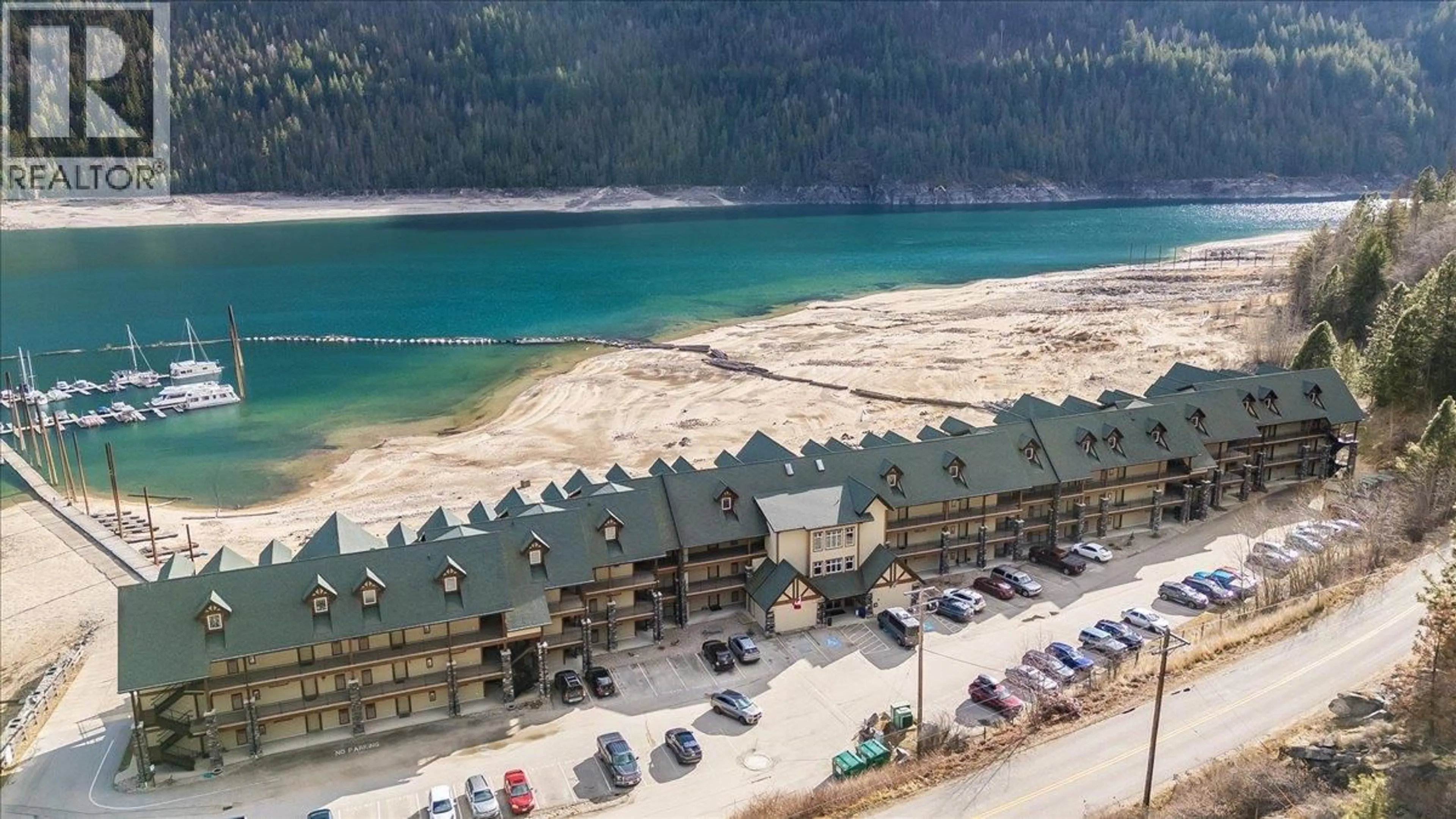 A pic from outside/outdoor area/front of a property/back of a property/a pic from drone, water/lake/river/ocean view for 315 - 5570 BROADWATER ROAD, Castlegar British Columbia V1N0A1