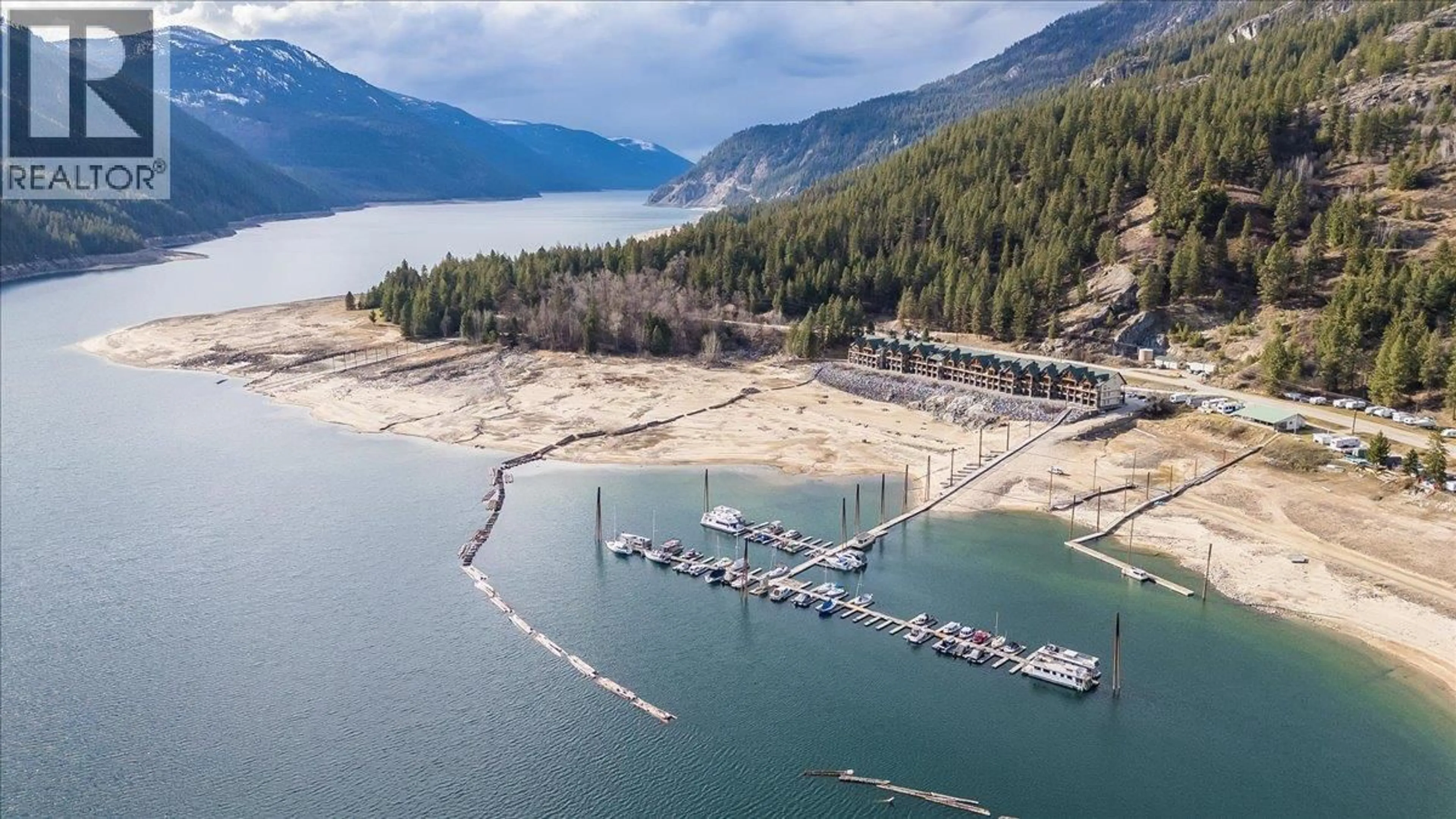 A pic from outside/outdoor area/front of a property/back of a property/a pic from drone, water/lake/river/ocean view for 315 - 5570 BROADWATER ROAD, Castlegar British Columbia V1N0A1