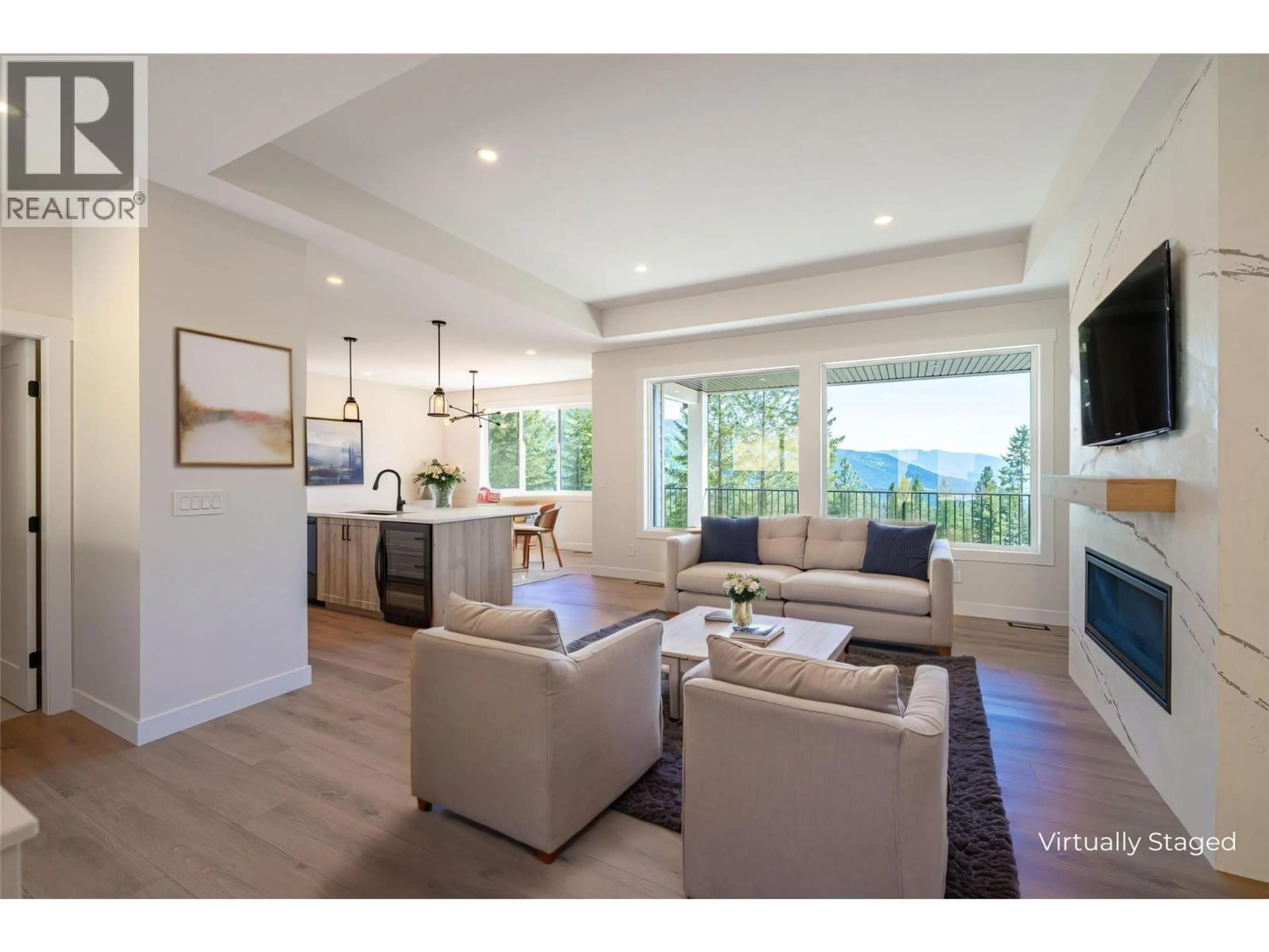 Living room with furniture, wood/laminate floor for 7863 BOULTER ROAD, Vernon British Columbia V1B3N2