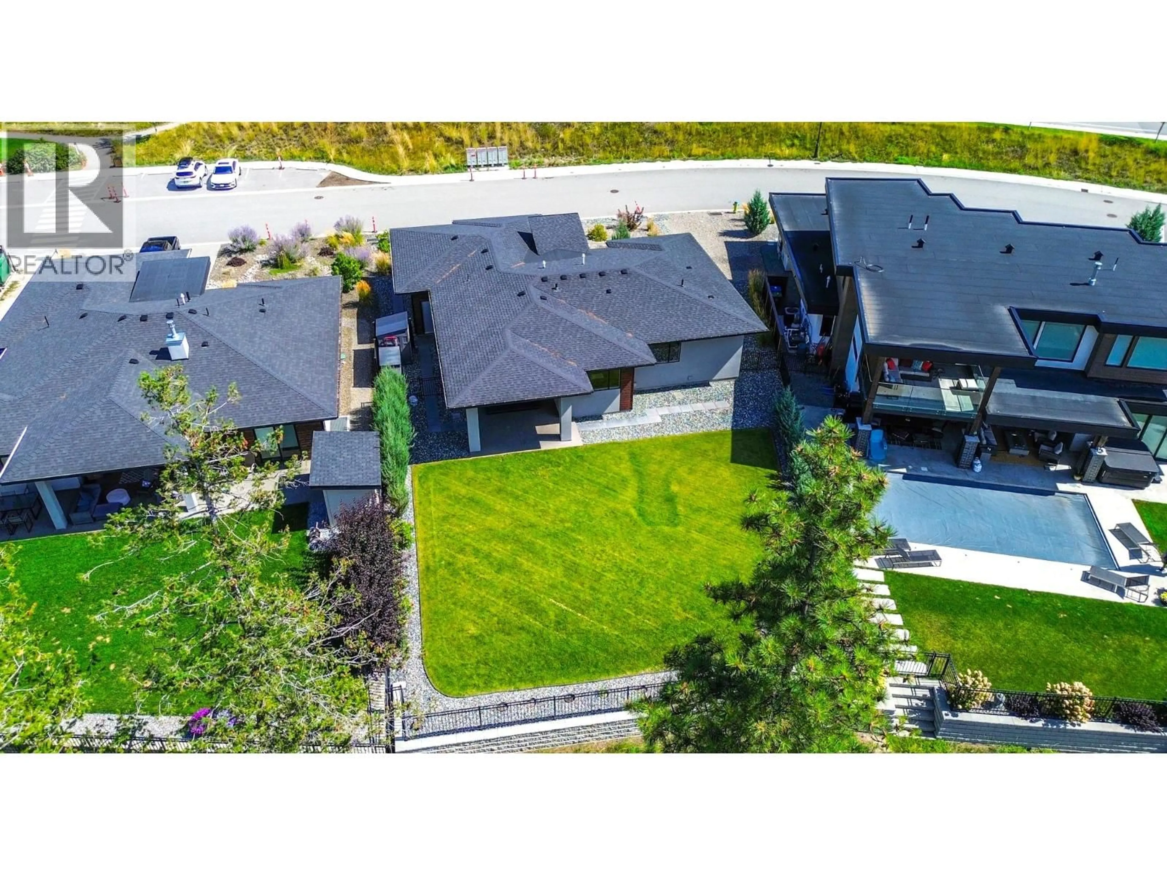 A pic from outside/outdoor area/front of a property/back of a property/a pic from drone, street for 9592 BENCHLAND DRIVE, Lake Country British Columbia V4V0A4