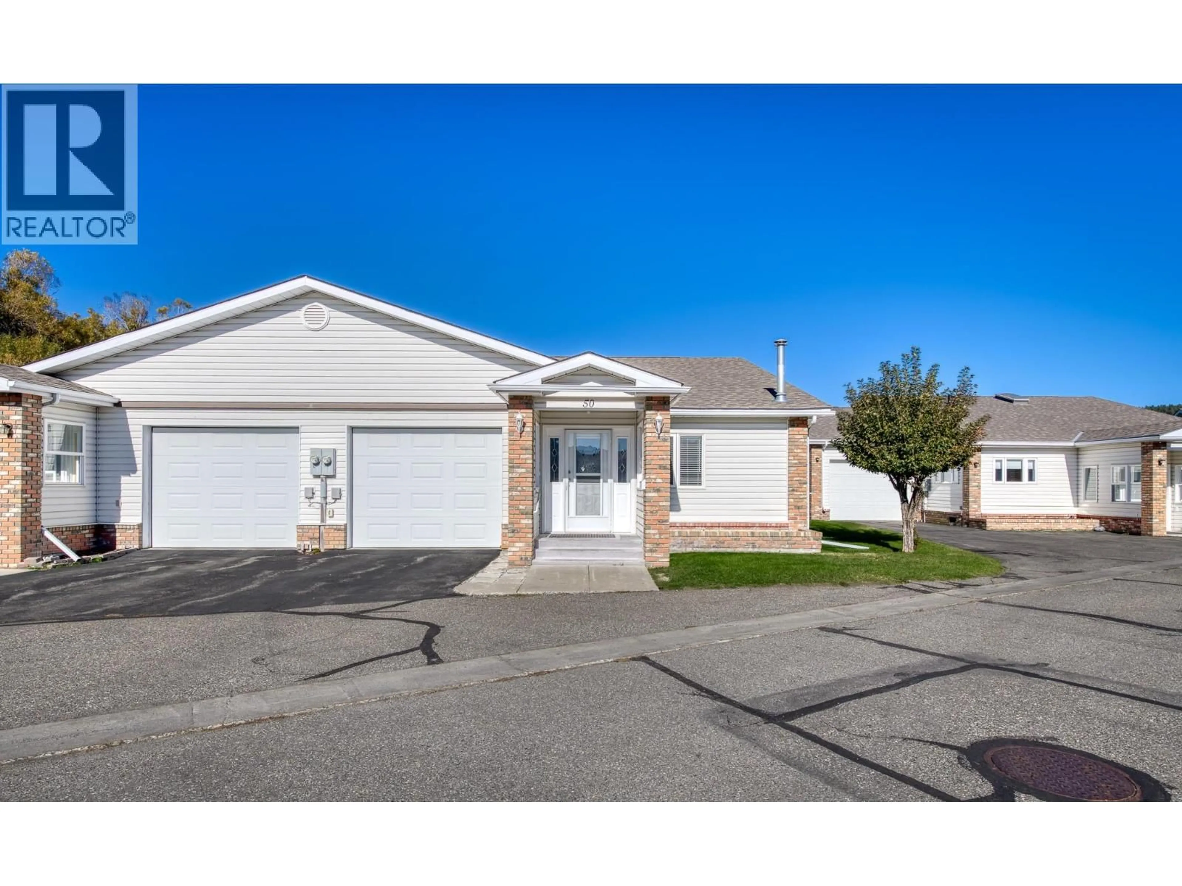 Home with vinyl exterior material, street for 50 - 2025 KOKANEE DRIVE NORTH, Cranbrook British Columbia V1C6J2