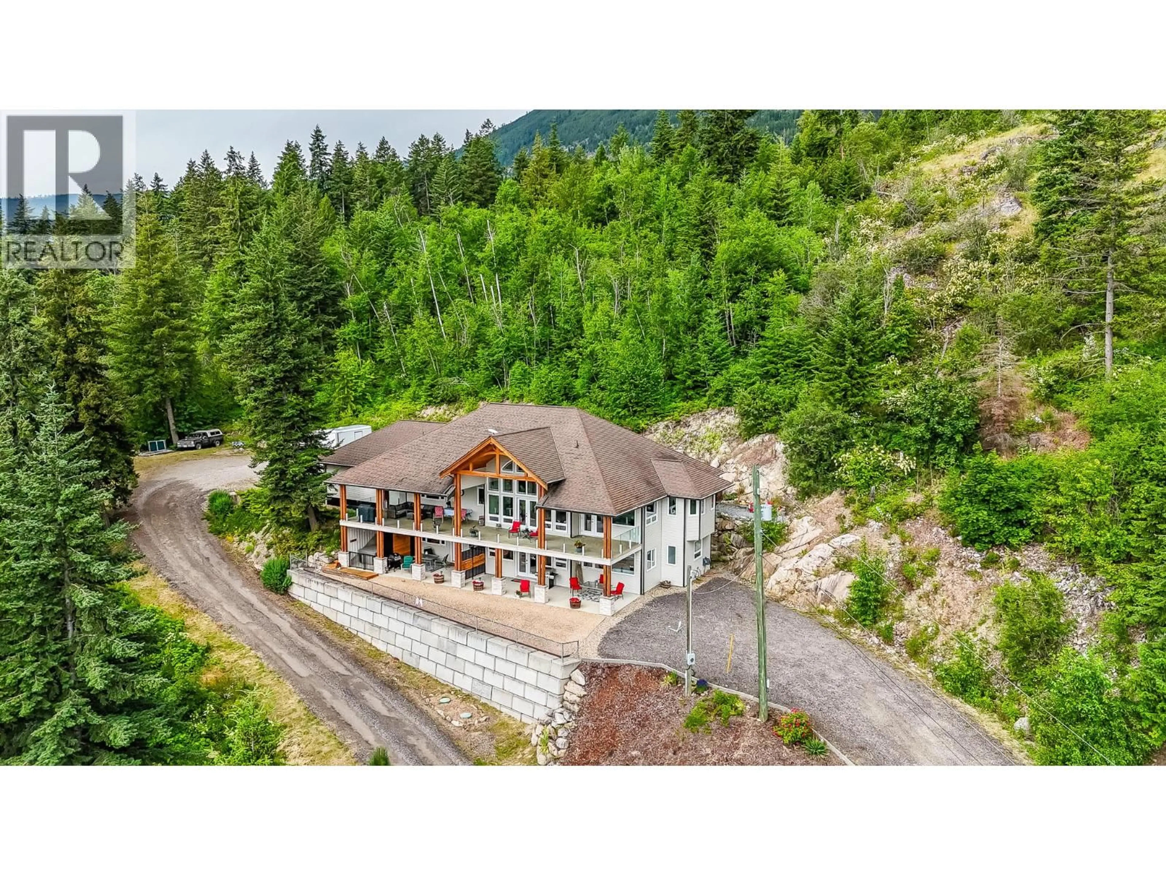 A pic from outside/outdoor area/front of a property/back of a property/a pic from drone, mountain view for 5694 TRANS CANADA HIGHWAY NORTHWEST, Salmon Arm British Columbia V1E3A2