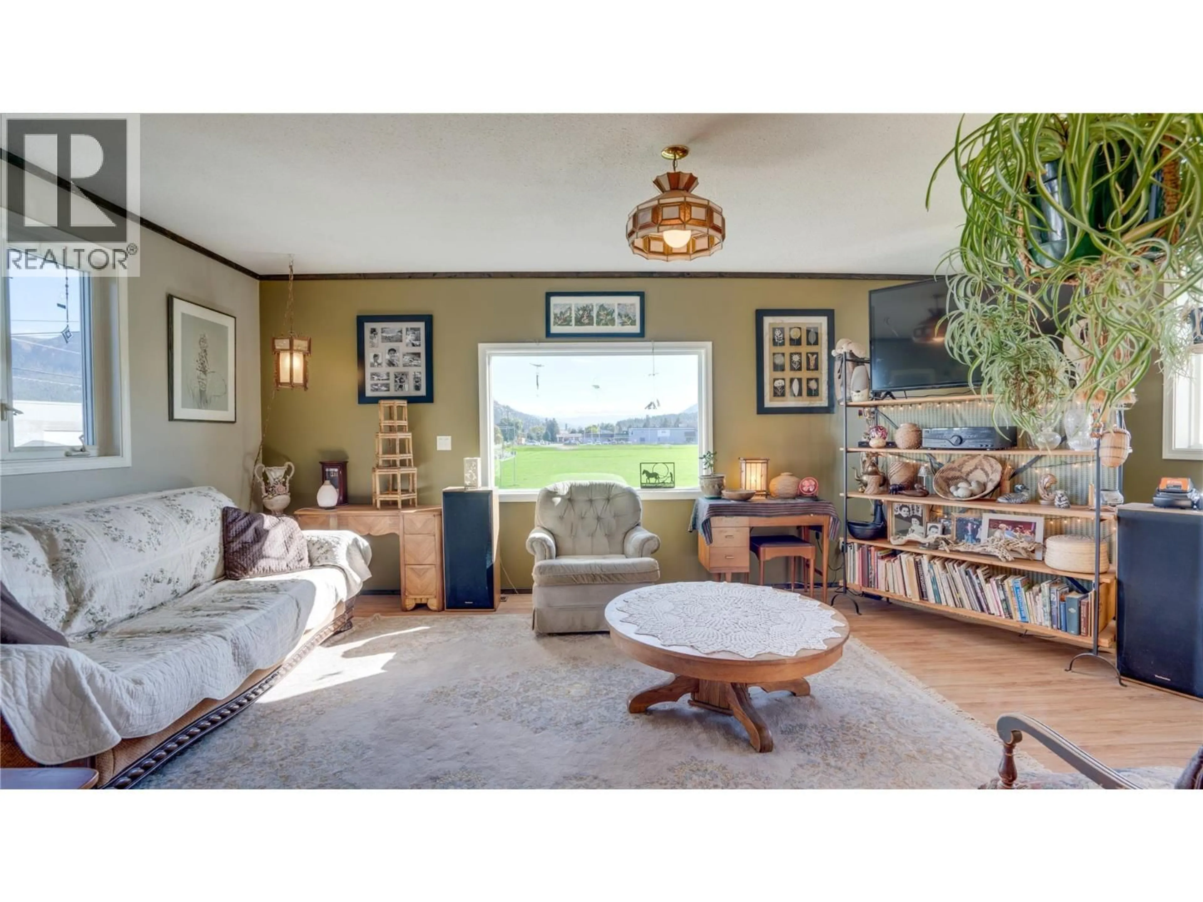 Living room with furniture, wood/laminate floor for 700 BASS AVENUE, Enderby British Columbia V0E1V2