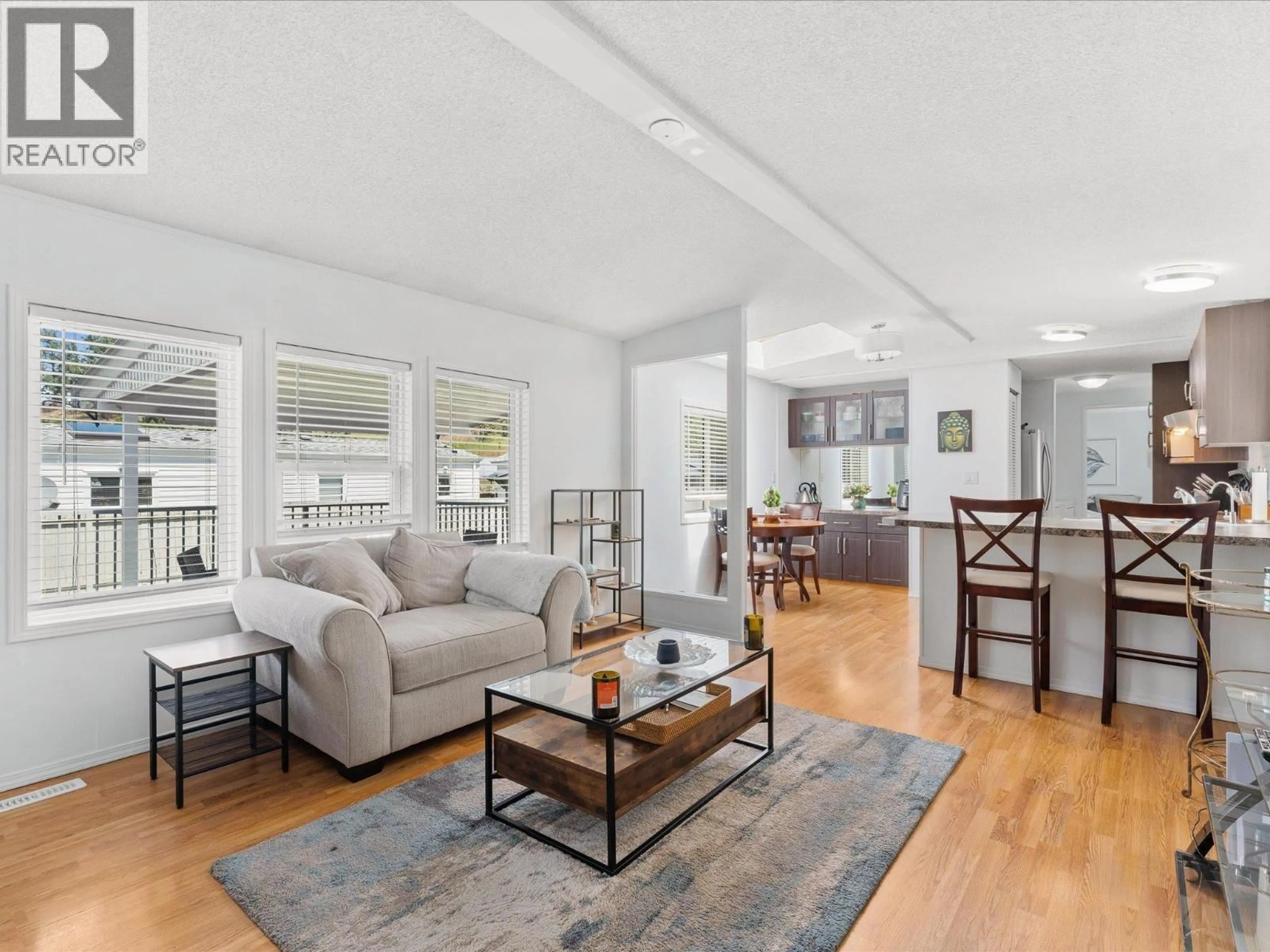 Living room with furniture, wood/laminate floor for 9 - 610 KATHERINE ROAD, West Kelowna British Columbia V1Z3G2