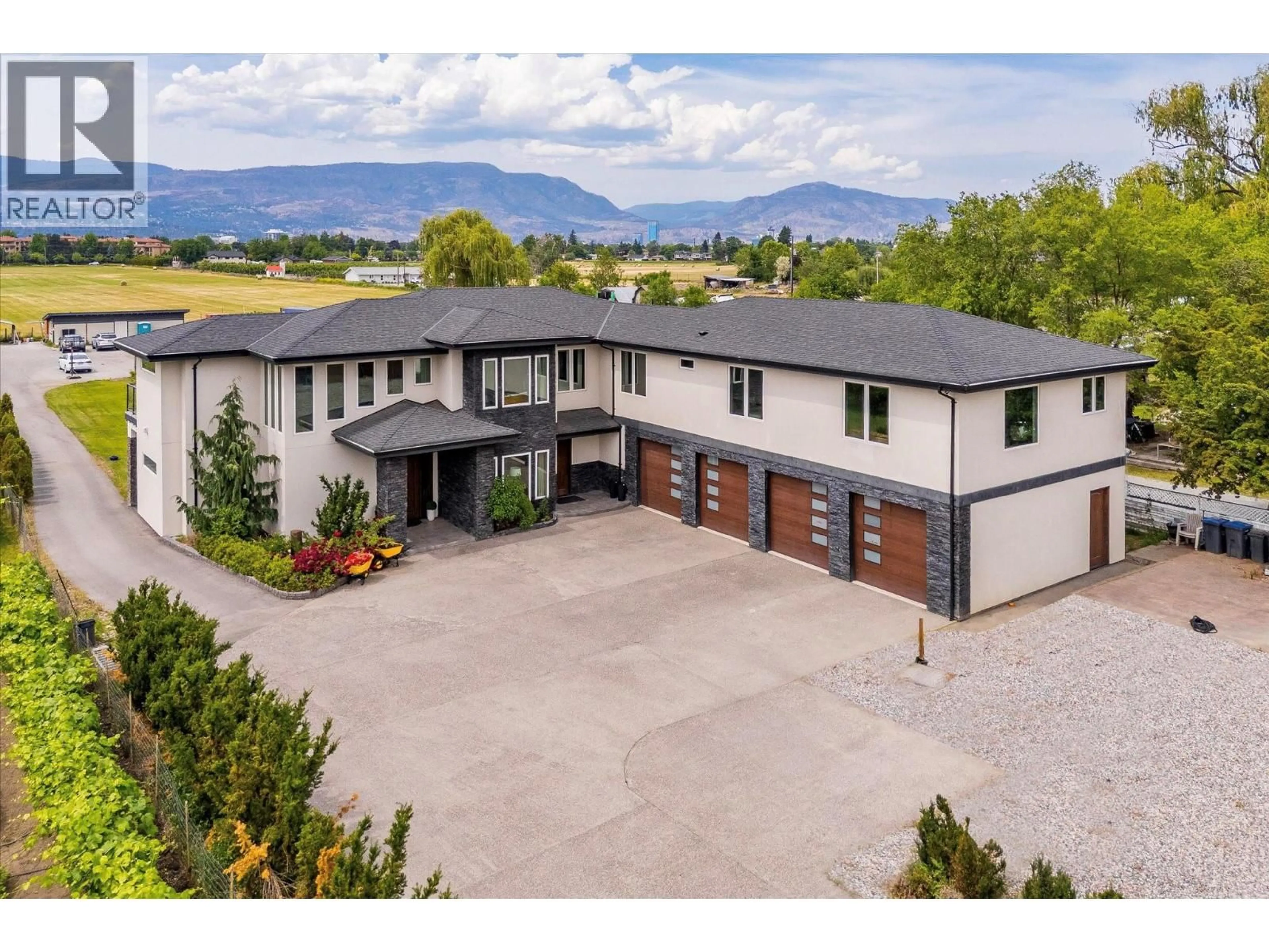 A pic from outside/outdoor area/front of a property/back of a property/a pic from drone, mountain view for 3666 BENVOULIN ROAD, Kelowna British Columbia V1W4M7