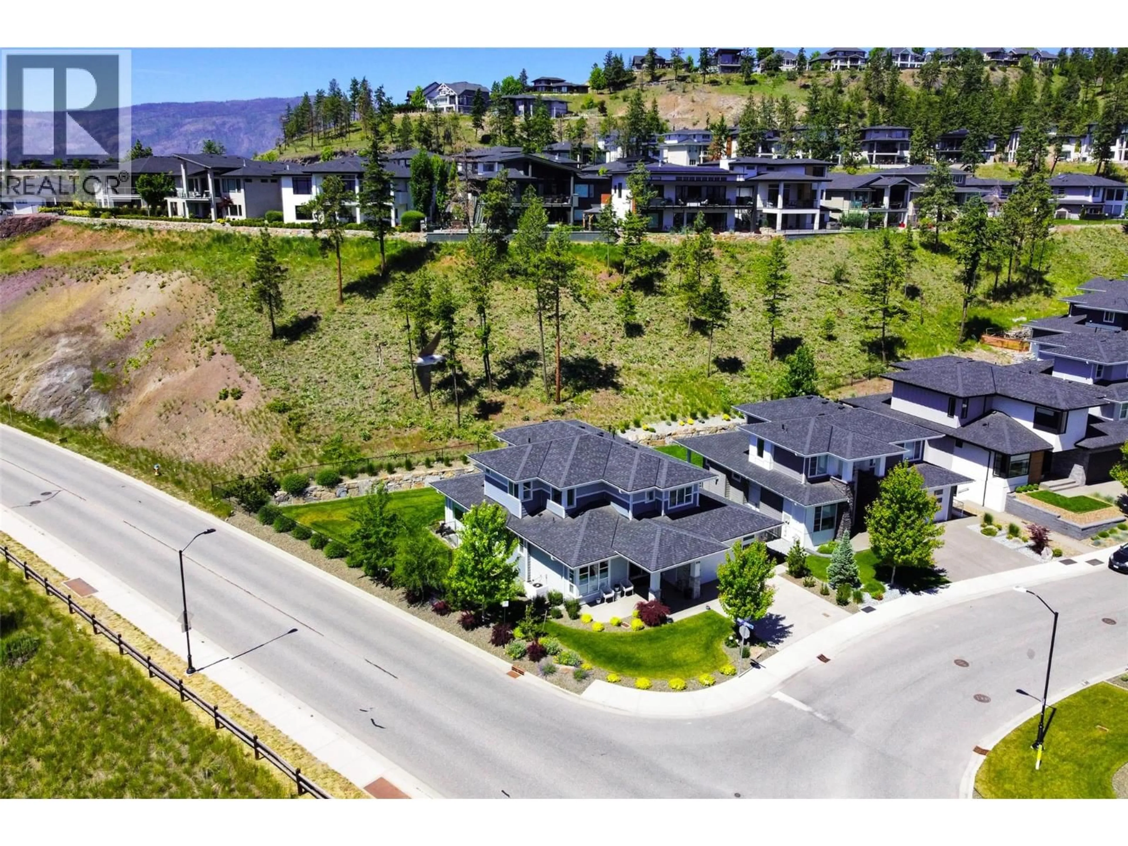 A pic from outside/outdoor area/front of a property/back of a property/a pic from drone, mountain view for 218 ECHO RIDGE DRIVE, Kelowna British Columbia V1V0C9