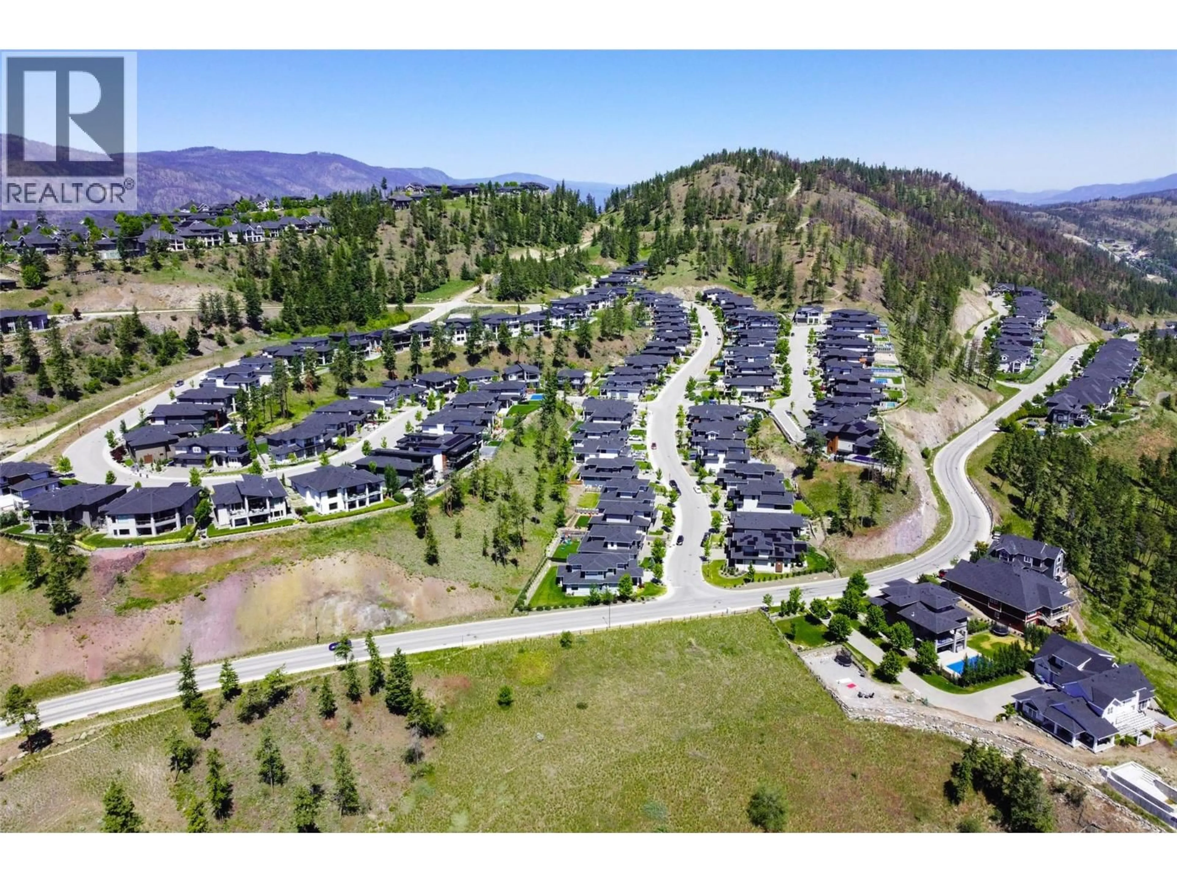 A pic from outside/outdoor area/front of a property/back of a property/a pic from drone, mountain view for 218 ECHO RIDGE DRIVE, Kelowna British Columbia V1V0C9