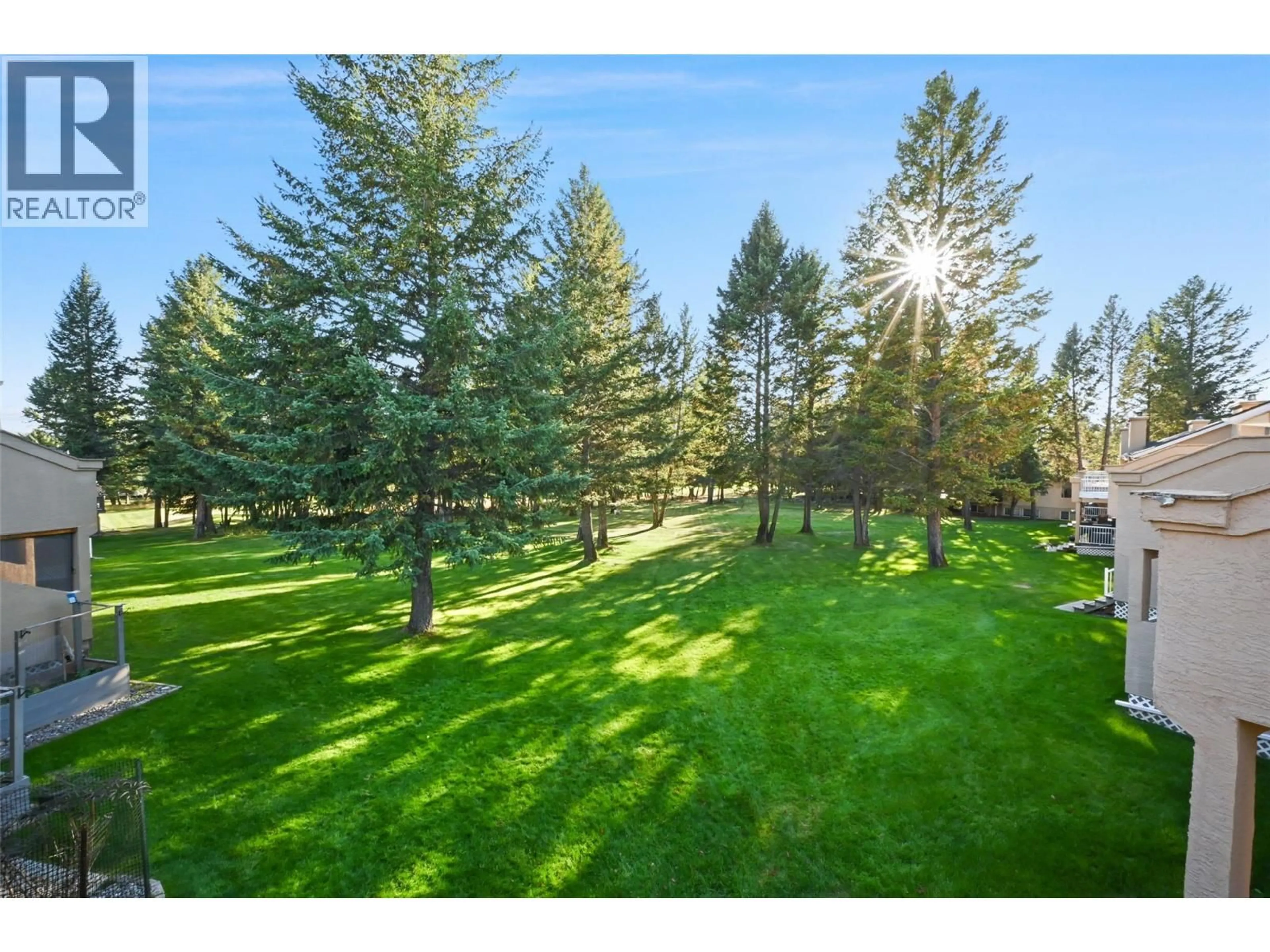 A pic from outside/outdoor area/front of a property/back of a property/a pic from drone, forest/trees view for 8 - 7595 PIONEER AVENUE, Radium Hot Springs British Columbia V0A1M0