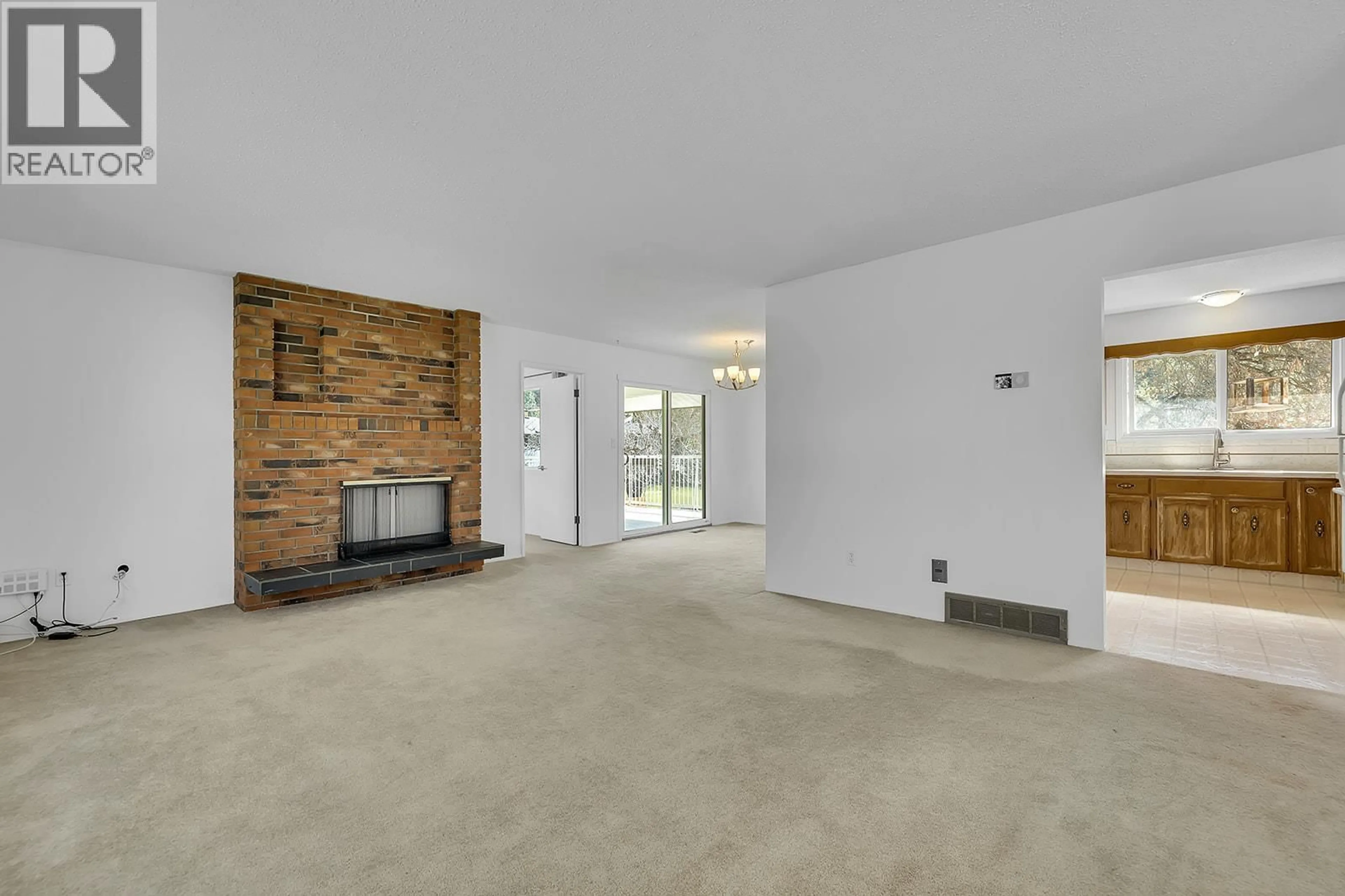 Living room with furniture, unknown for 811 TAMARACK DRIVE, Kelowna British Columbia V1X1E3