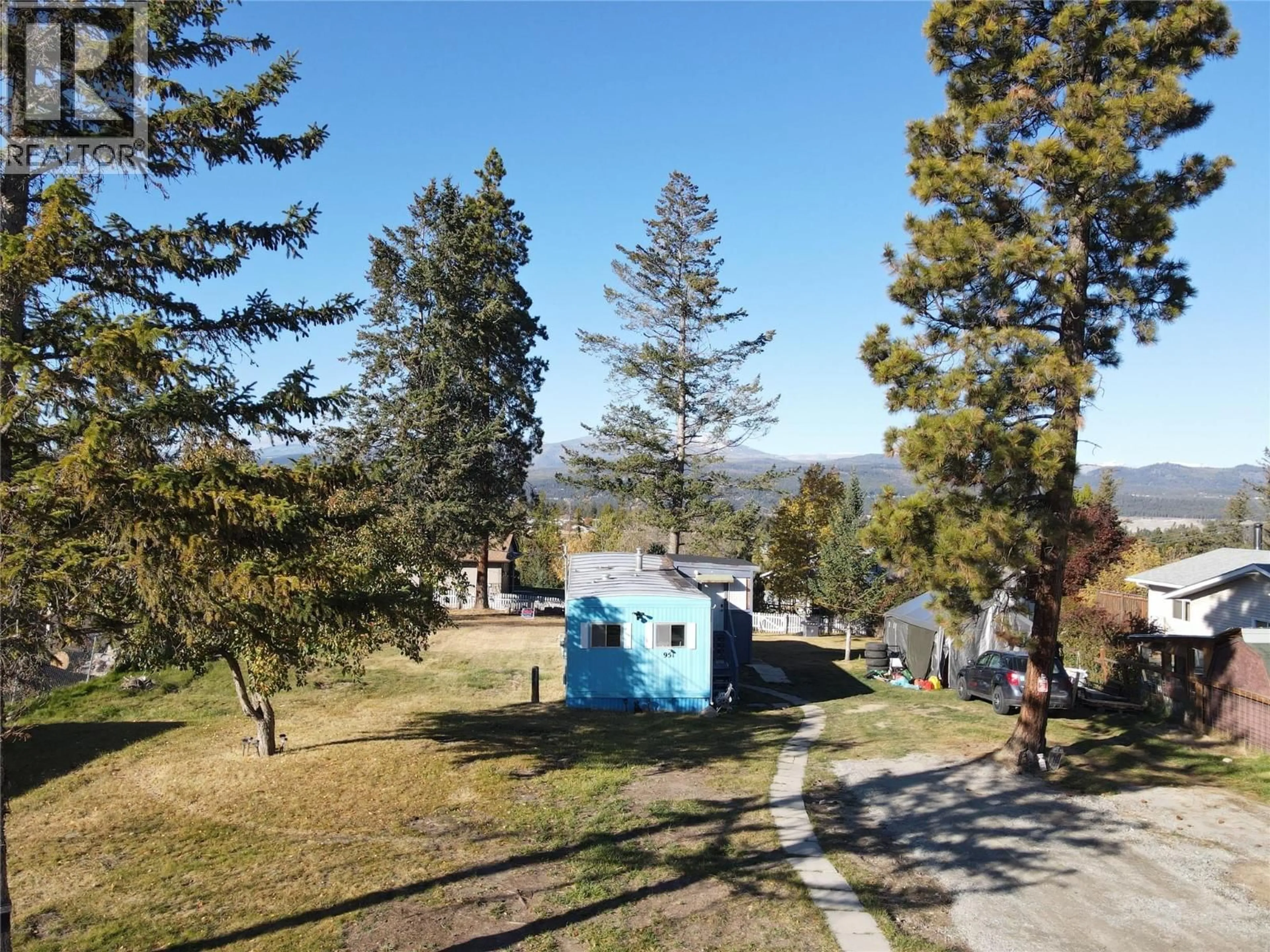 A pic from outside/outdoor area/front of a property/back of a property/a pic from drone, mountain view for 951 29TH AVENUE SOUTH, Cranbrook British Columbia V1C3K7