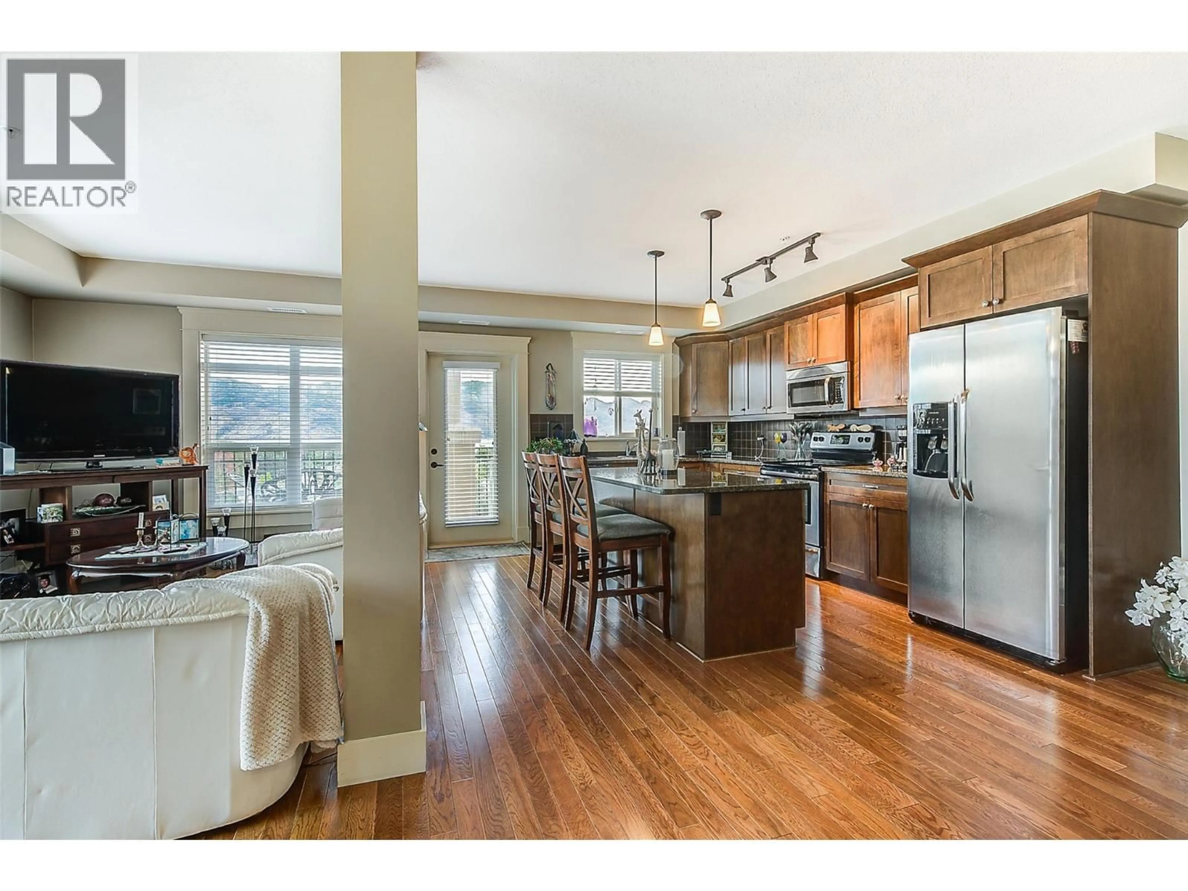Open concept kitchen, wood/laminate floor for 517 - 2070 BOUCHERIE ROAD, West Kelowna British Columbia V4T3K9