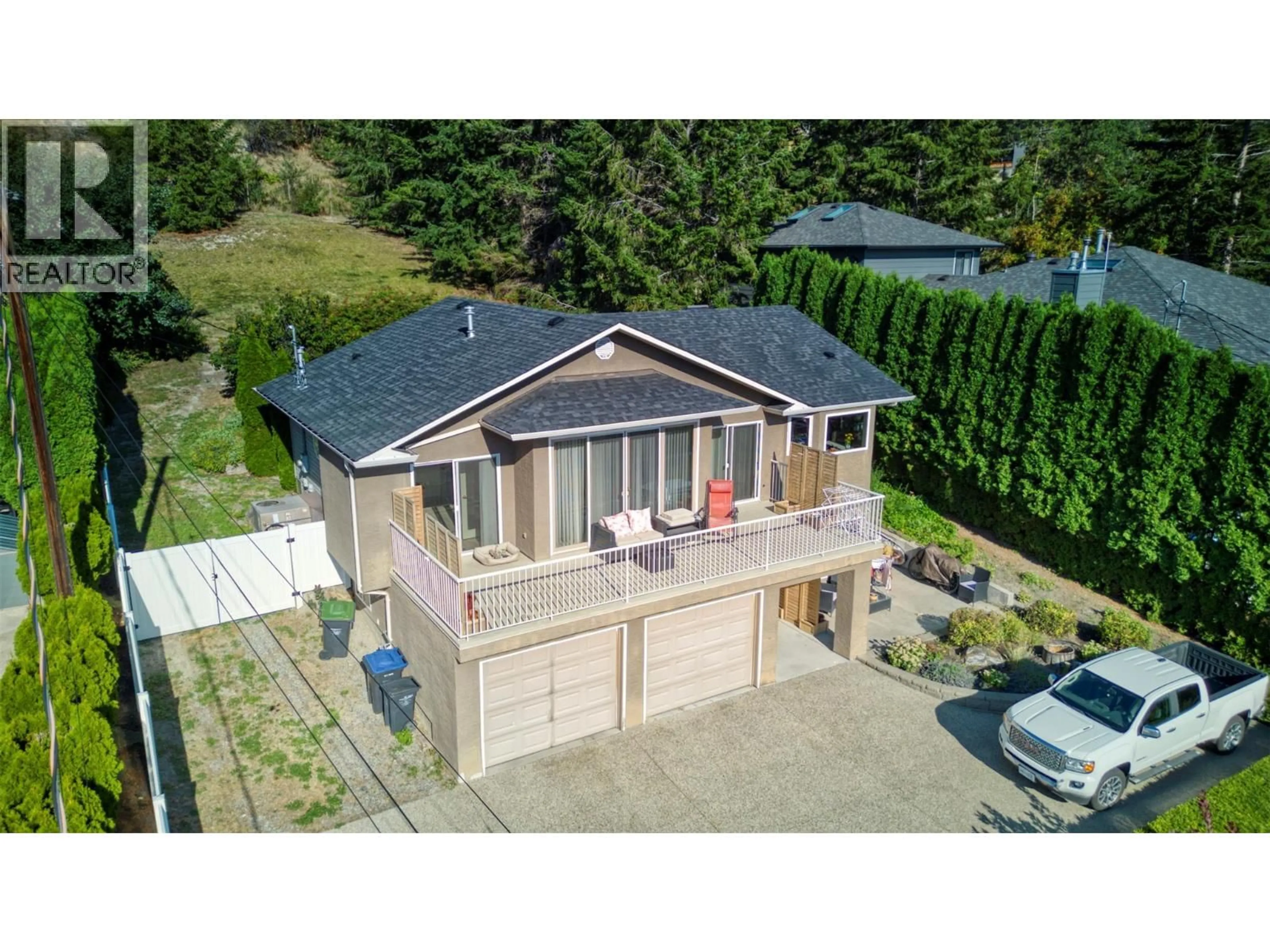A pic from outside/outdoor area/front of a property/back of a property/a pic from drone, street for 12975 PIXTON ROAD, Lake Country British Columbia V4V1C9