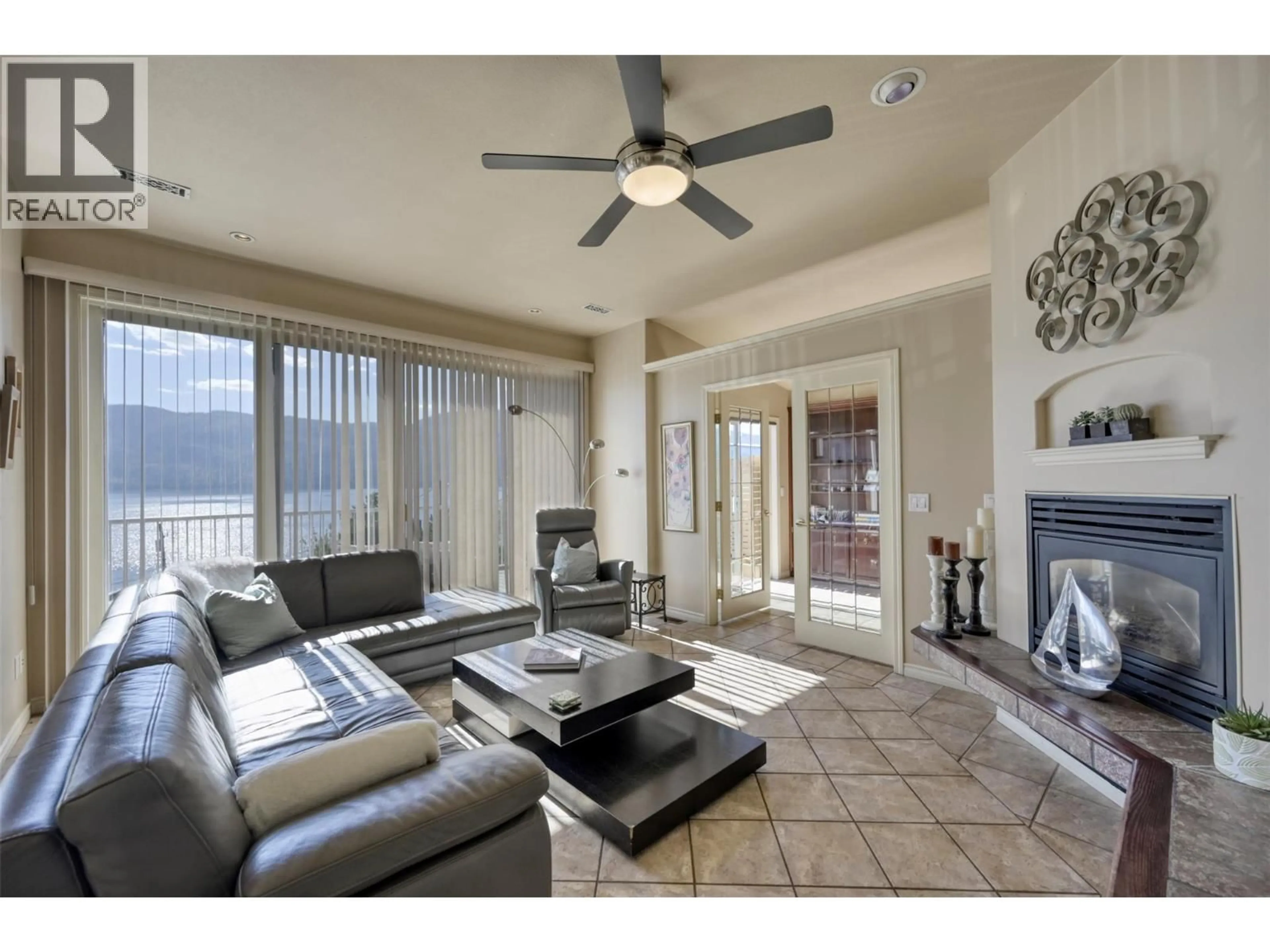 Living room with furniture, ceramic/tile floor for 12975 PIXTON ROAD, Lake Country British Columbia V4V1C9
