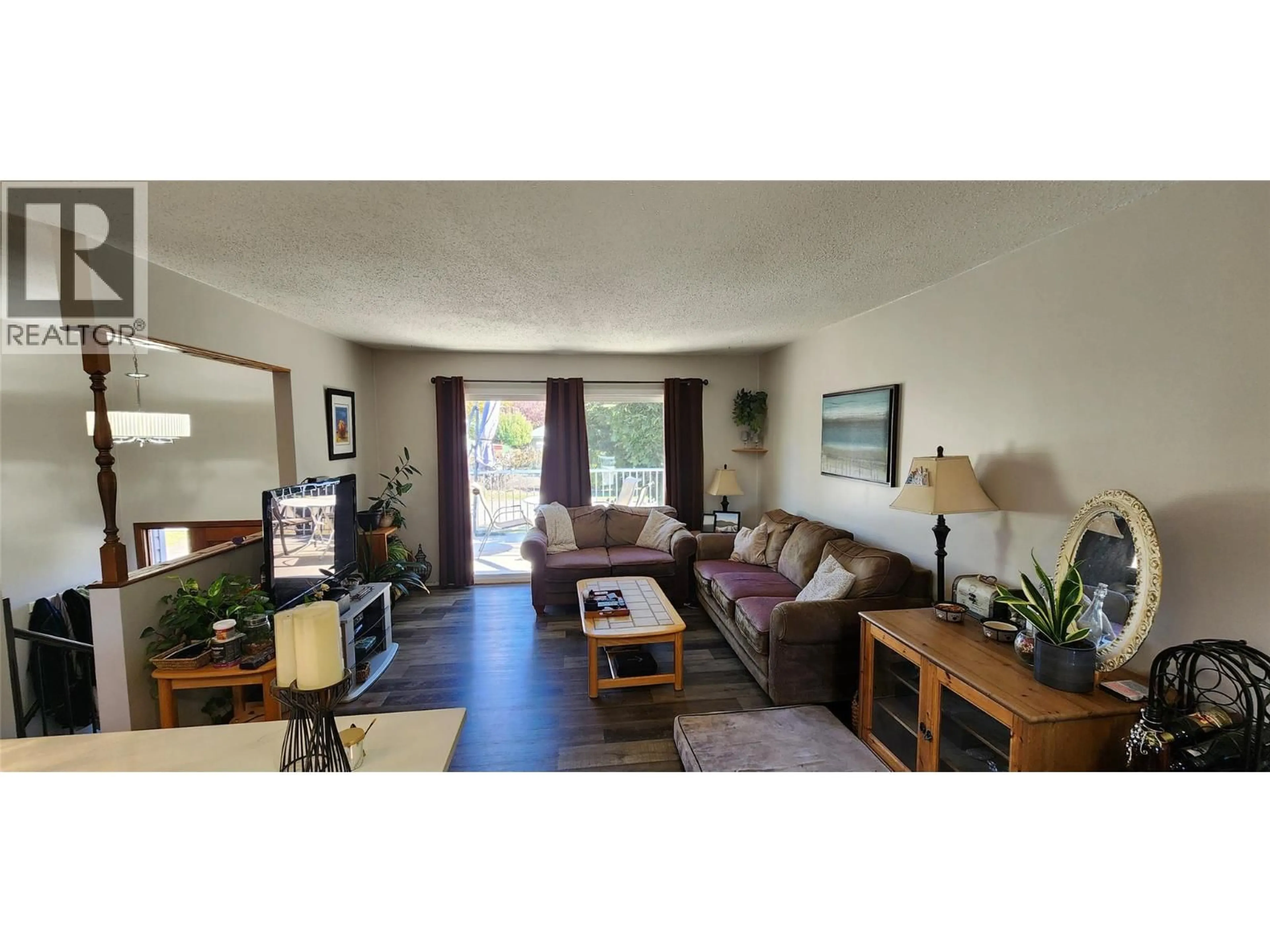 Living room with furniture, wood/laminate floor for 6649 VAN-NESS WAY, Grand Forks British Columbia V0H1H0