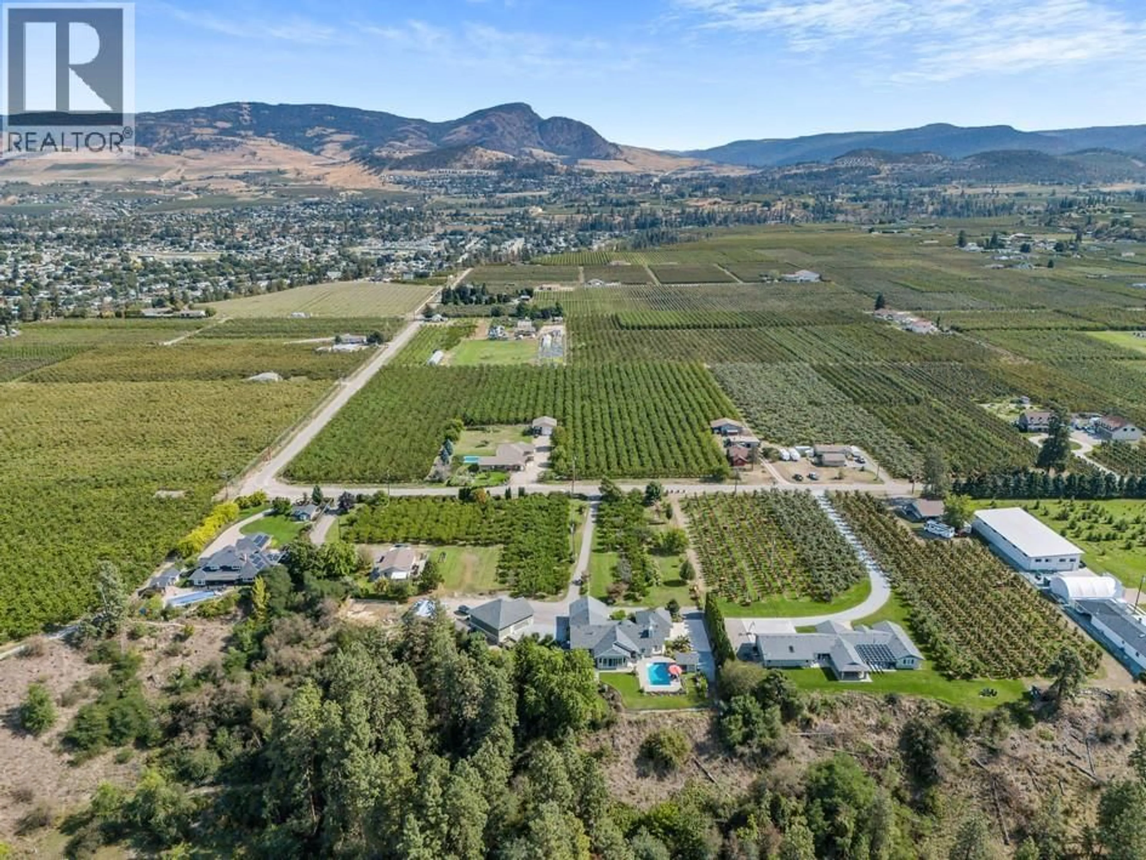 A pic from outside/outdoor area/front of a property/back of a property/a pic from drone, mountain view for 3022 DUNSTER ROAD, Kelowna British Columbia V1W4H3