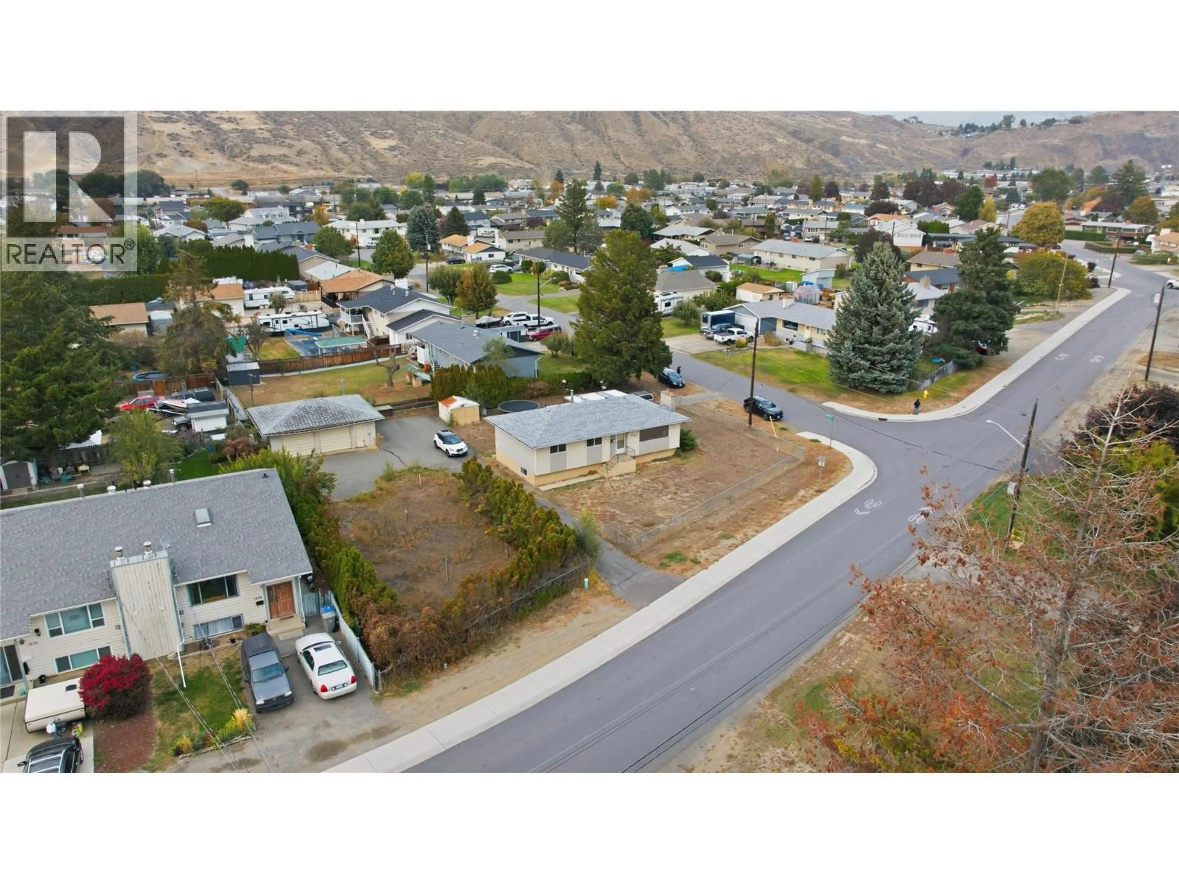 A pic from outside/outdoor area/front of a property/back of a property/a pic from drone, mountain view for 1838 FLEETWOOD AVENUE, Kamloops British Columbia V2B4S1