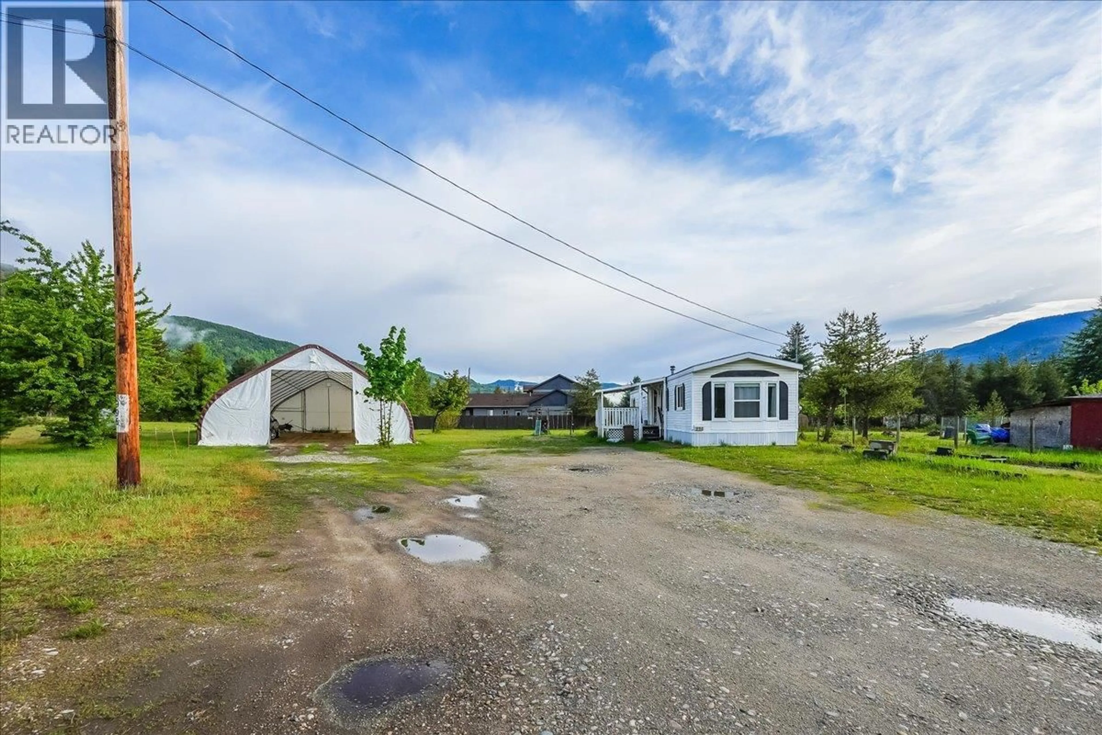 A pic from outside/outdoor area/front of a property/back of a property/a pic from drone, mountain view for 996 WATERLOO ROAD, Ootischenia British Columbia V1N4M3