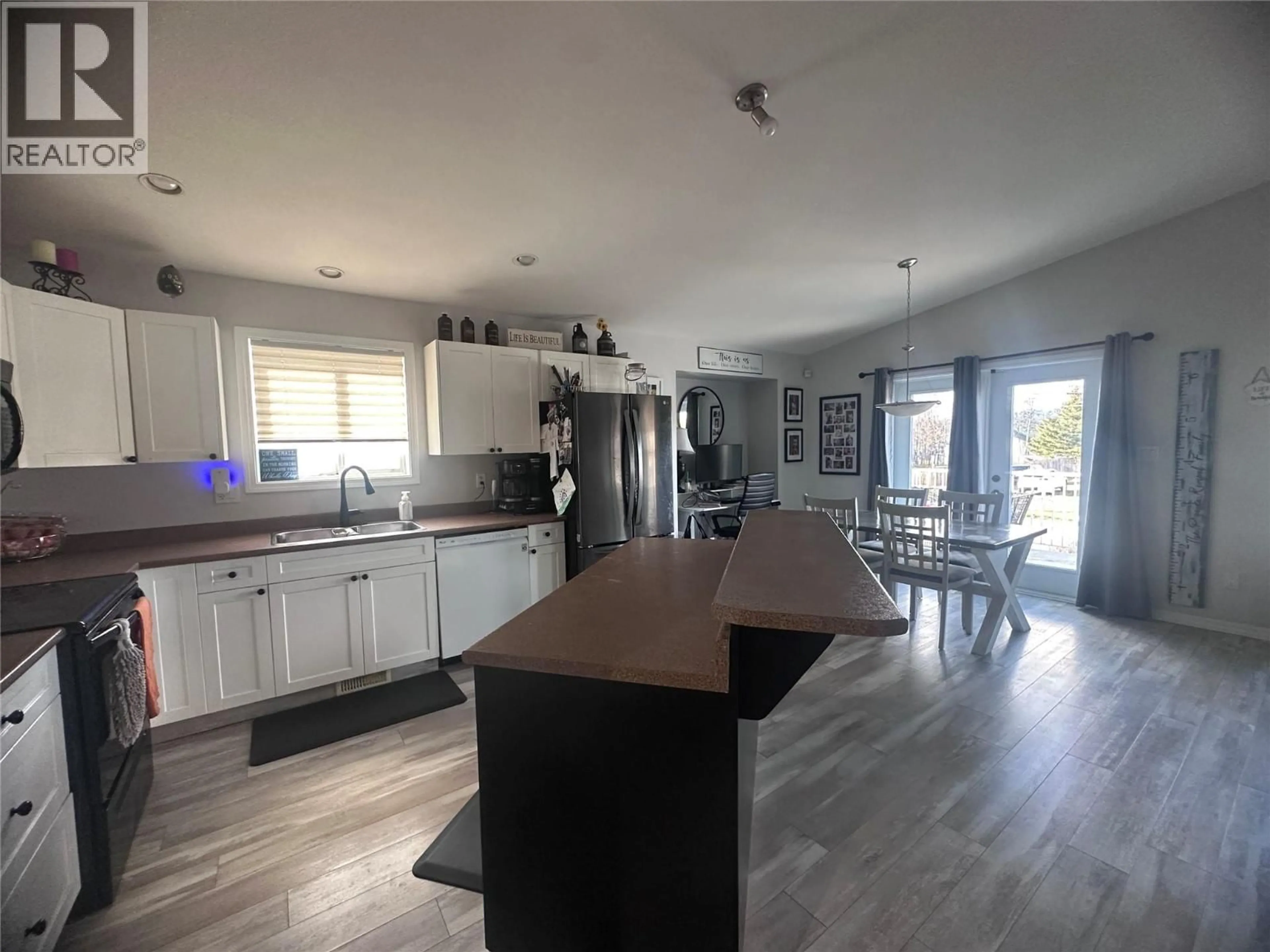 Open concept kitchen, wood/laminate floor for 5200 41 STREET, Chetwynd British Columbia V0C1J0