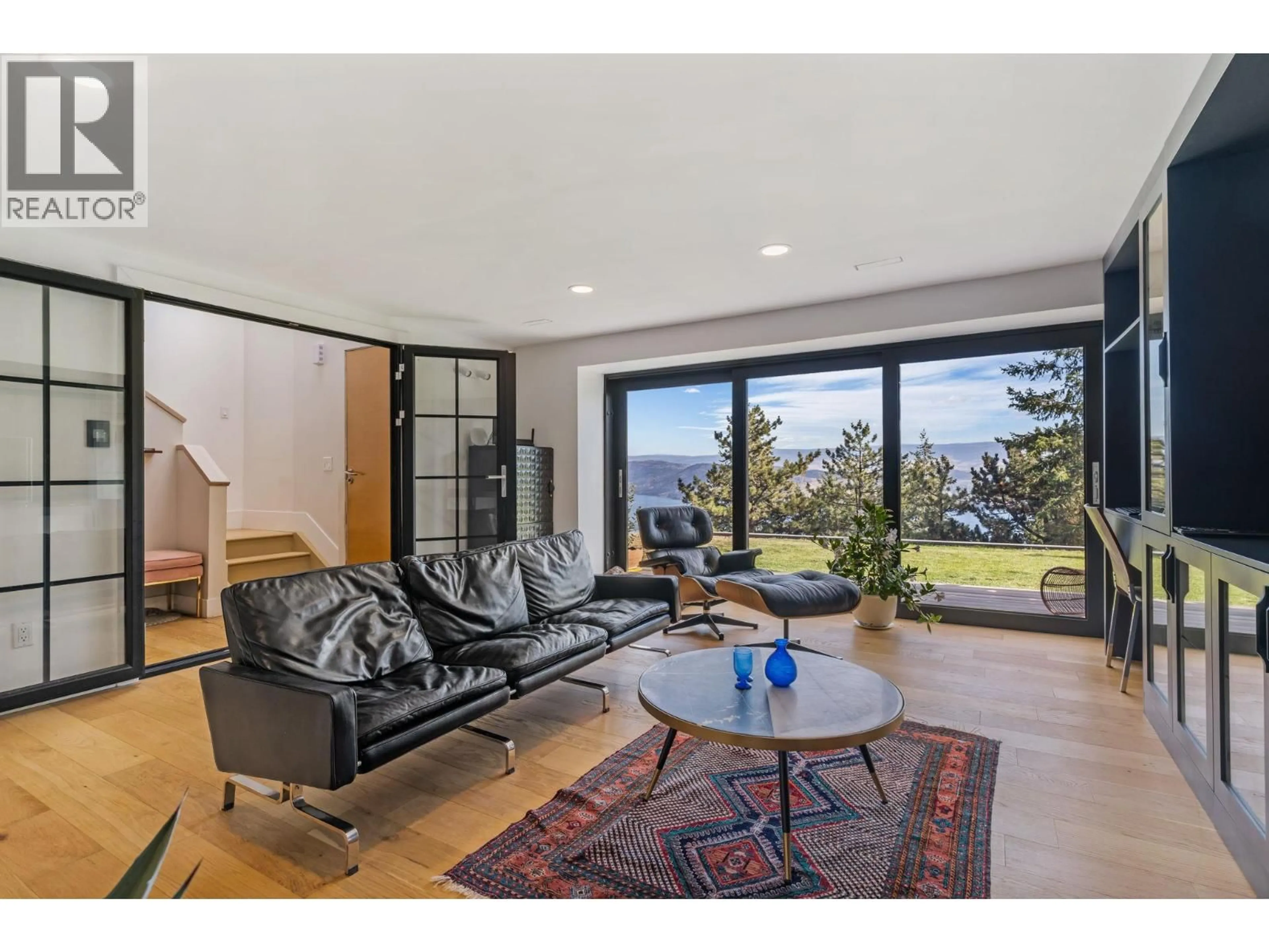 Living room with furniture, wood/laminate floor for 1632 GRIFFITHS PLACE, West Kelowna British Columbia V1Z2T7