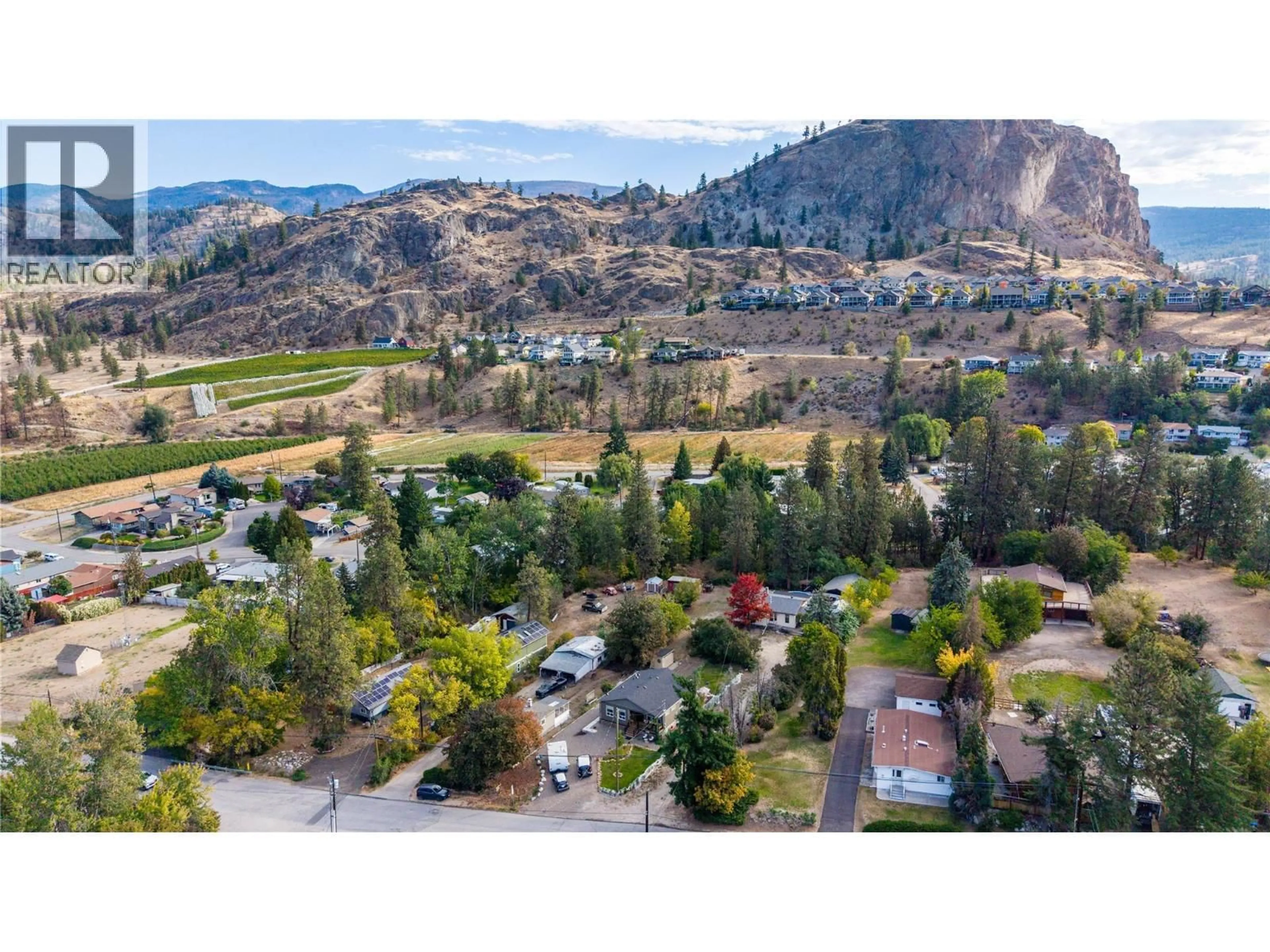 A pic from outside/outdoor area/front of a property/back of a property/a pic from drone, mountain view for 1155 MAPLE STREET, Okanagan Falls British Columbia V0H1R0