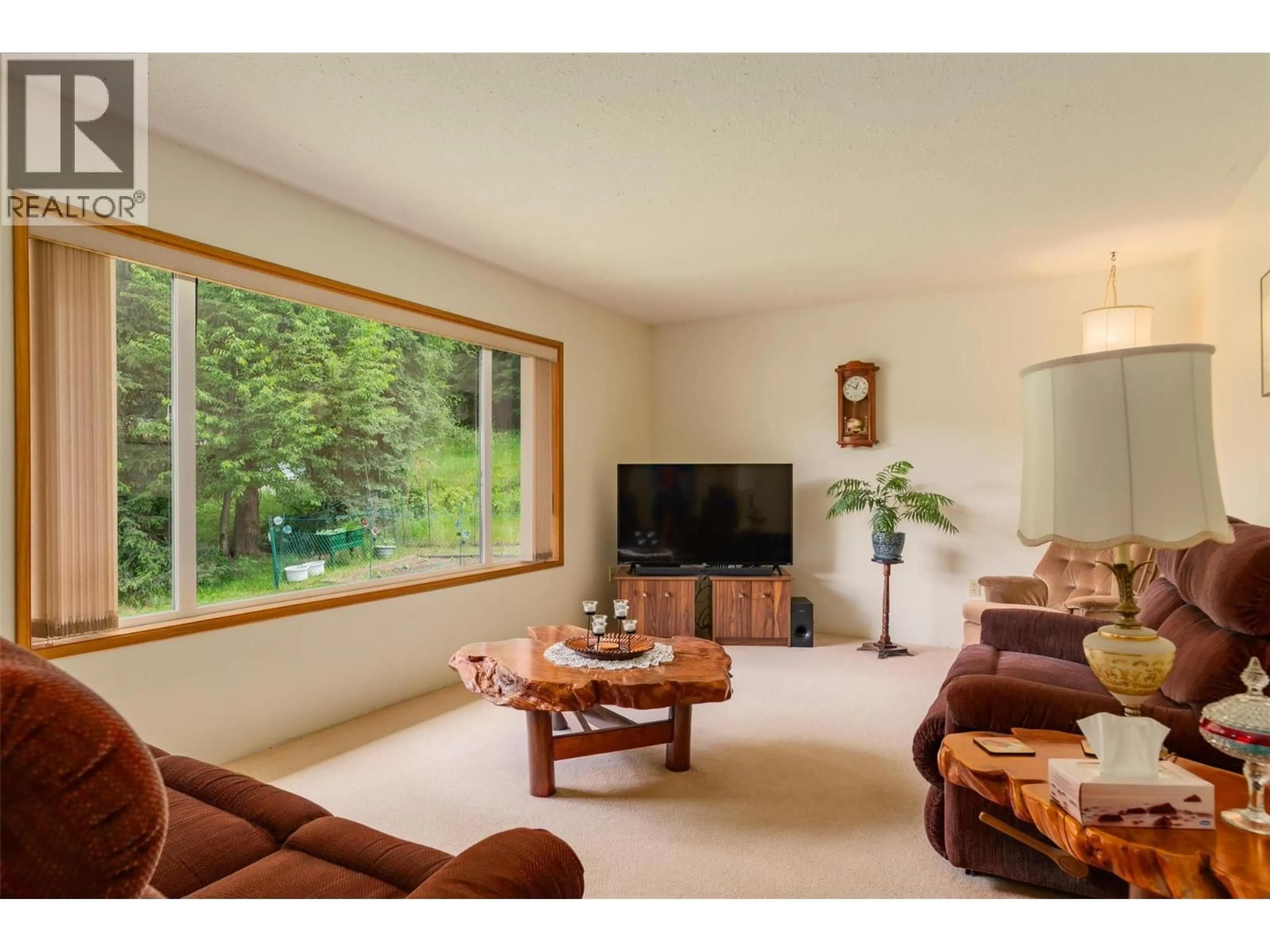 Living room with furniture, wood/laminate floor for 1764 GREEN ROAD, Fruitvale British Columbia V0G1L0