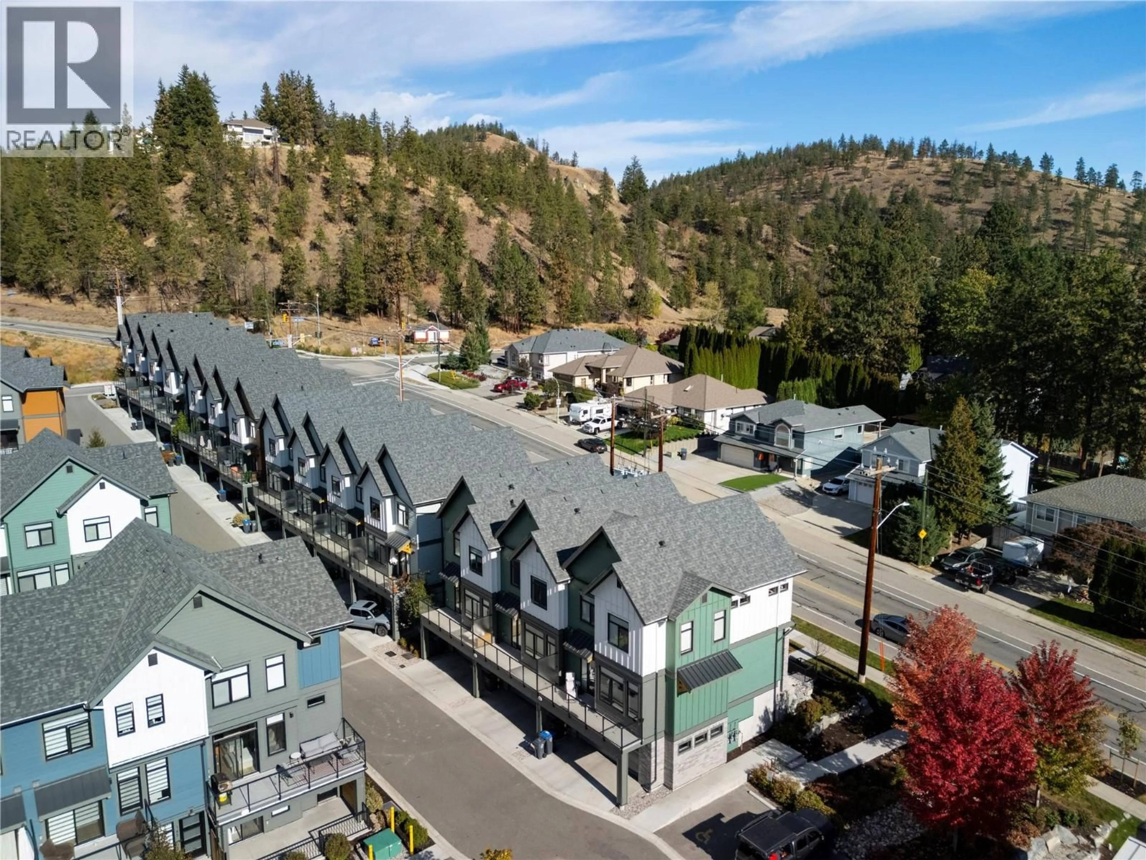 A pic from outside/outdoor area/front of a property/back of a property/a pic from drone, mountain view for 113 - 1435 CARA GLEN WAY, Kelowna British Columbia V1V0G1