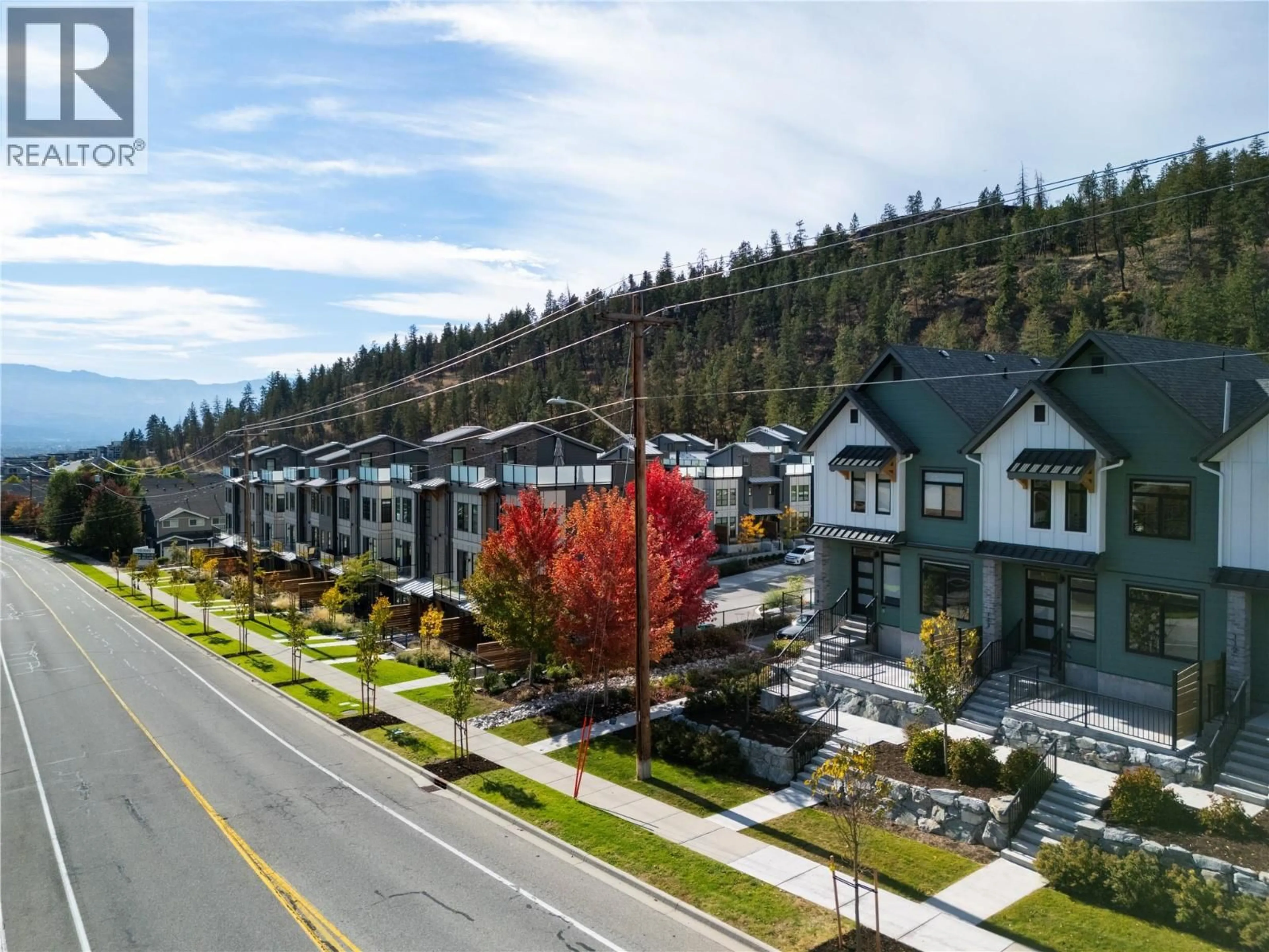 A pic from outside/outdoor area/front of a property/back of a property/a pic from drone, mountain view for 113 - 1435 CARA GLEN WAY, Kelowna British Columbia V1V0G1
