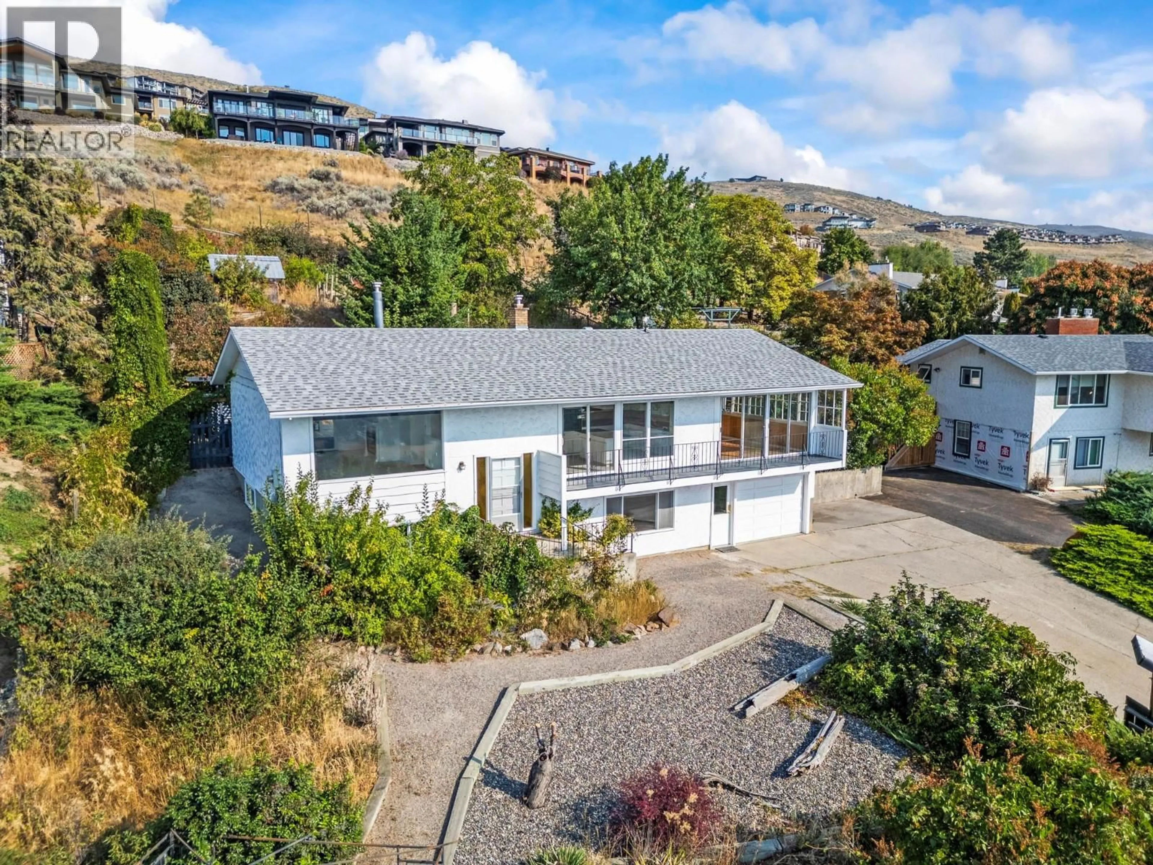 A pic from outside/outdoor area/front of a property/back of a property/a pic from drone, unknown for 7061 APPALOOSA WAY, Vernon British Columbia V1H1B9