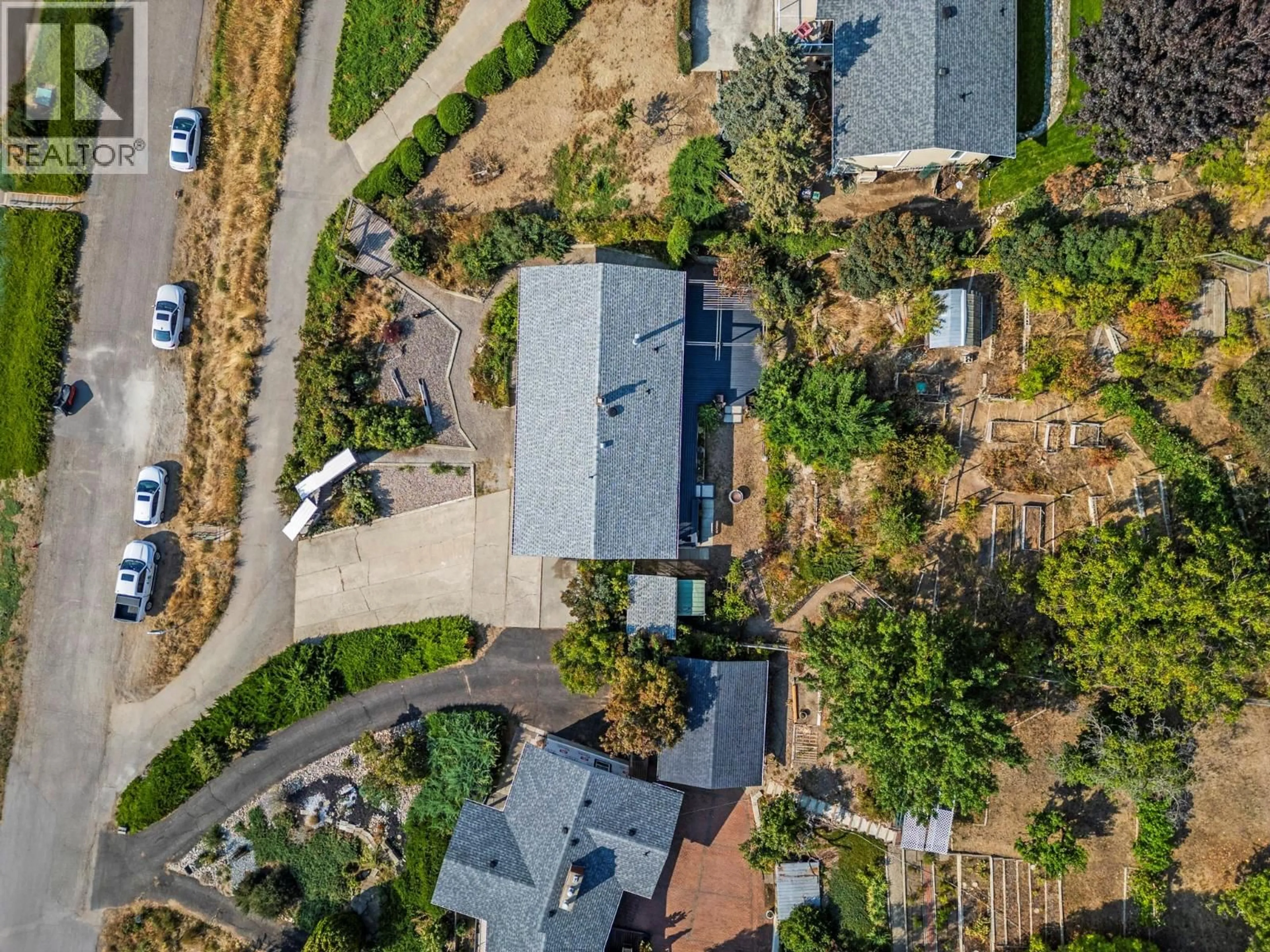 A pic from outside/outdoor area/front of a property/back of a property/a pic from drone, street for 7061 APPALOOSA WAY, Vernon British Columbia V1H1B9