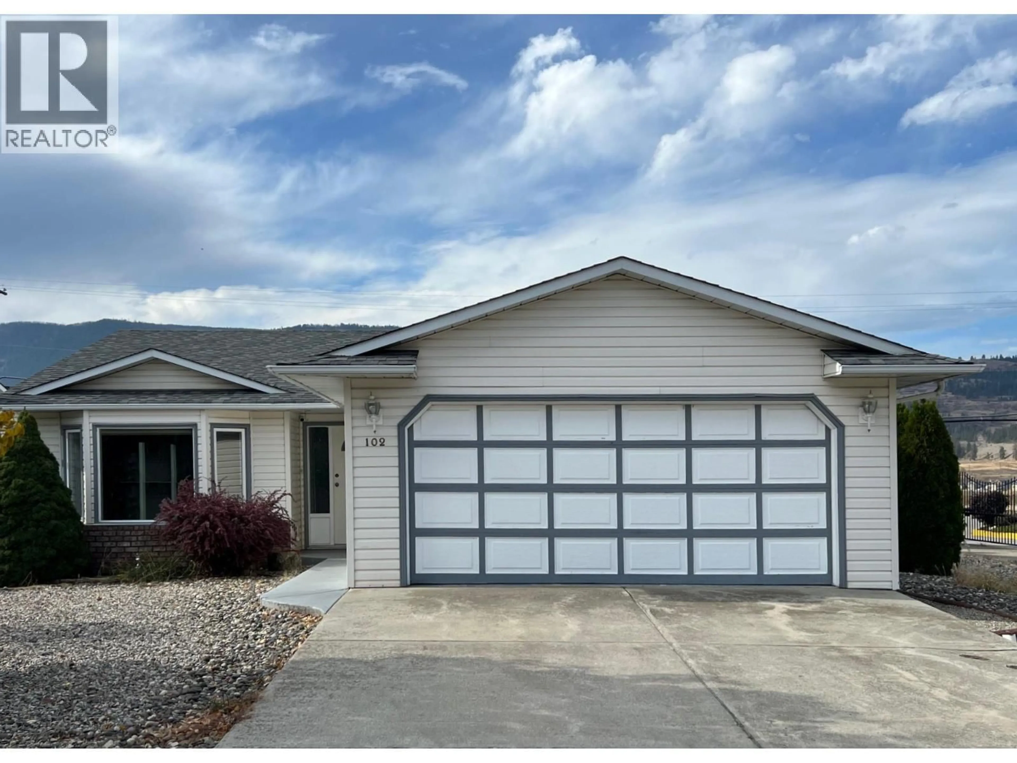 Home with vinyl exterior material, street for 102 1ST STREET, Vernon British Columbia V1H1Z1