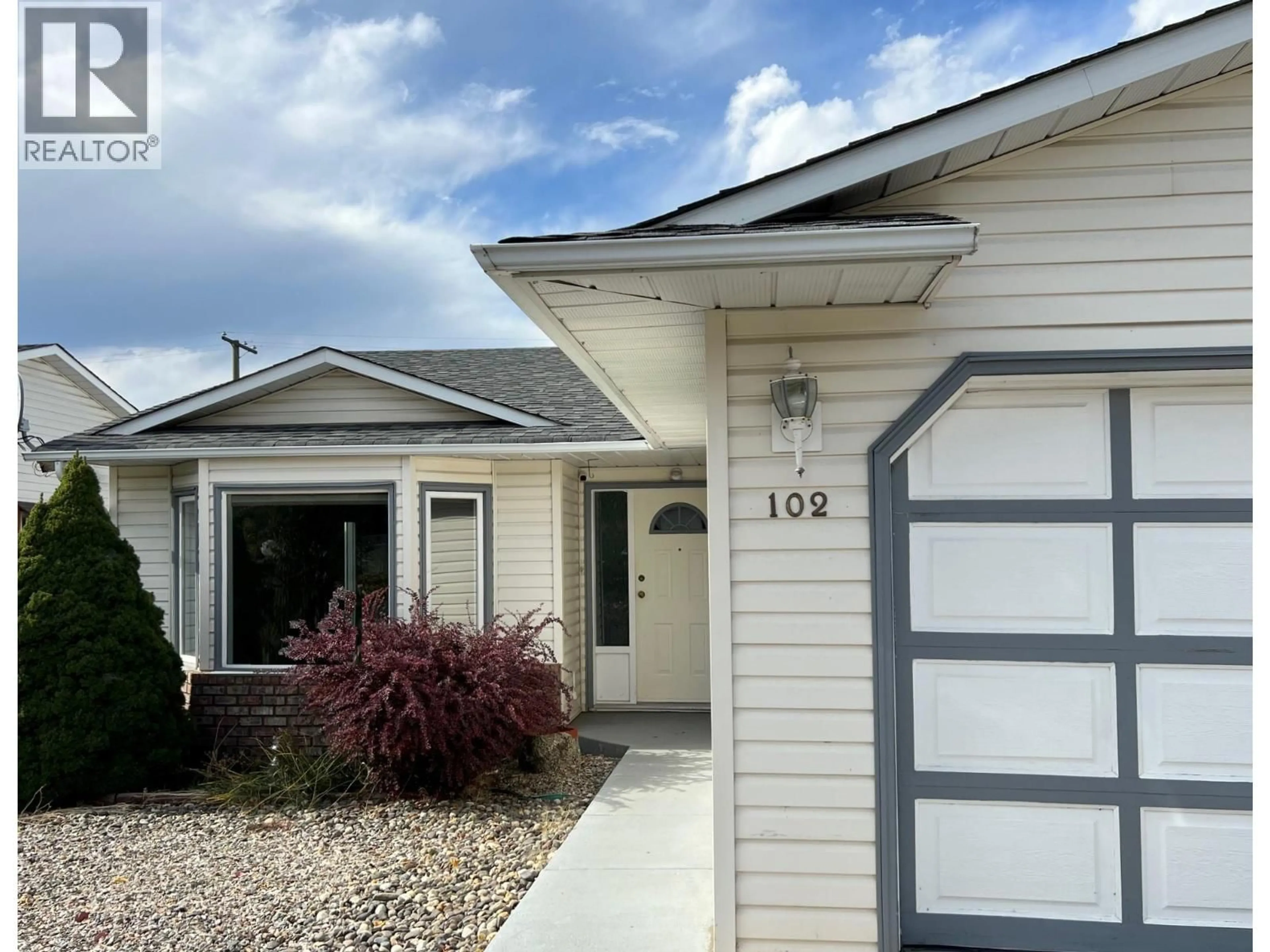 Home with vinyl exterior material, street for 102 1ST STREET, Vernon British Columbia V1H1Z1