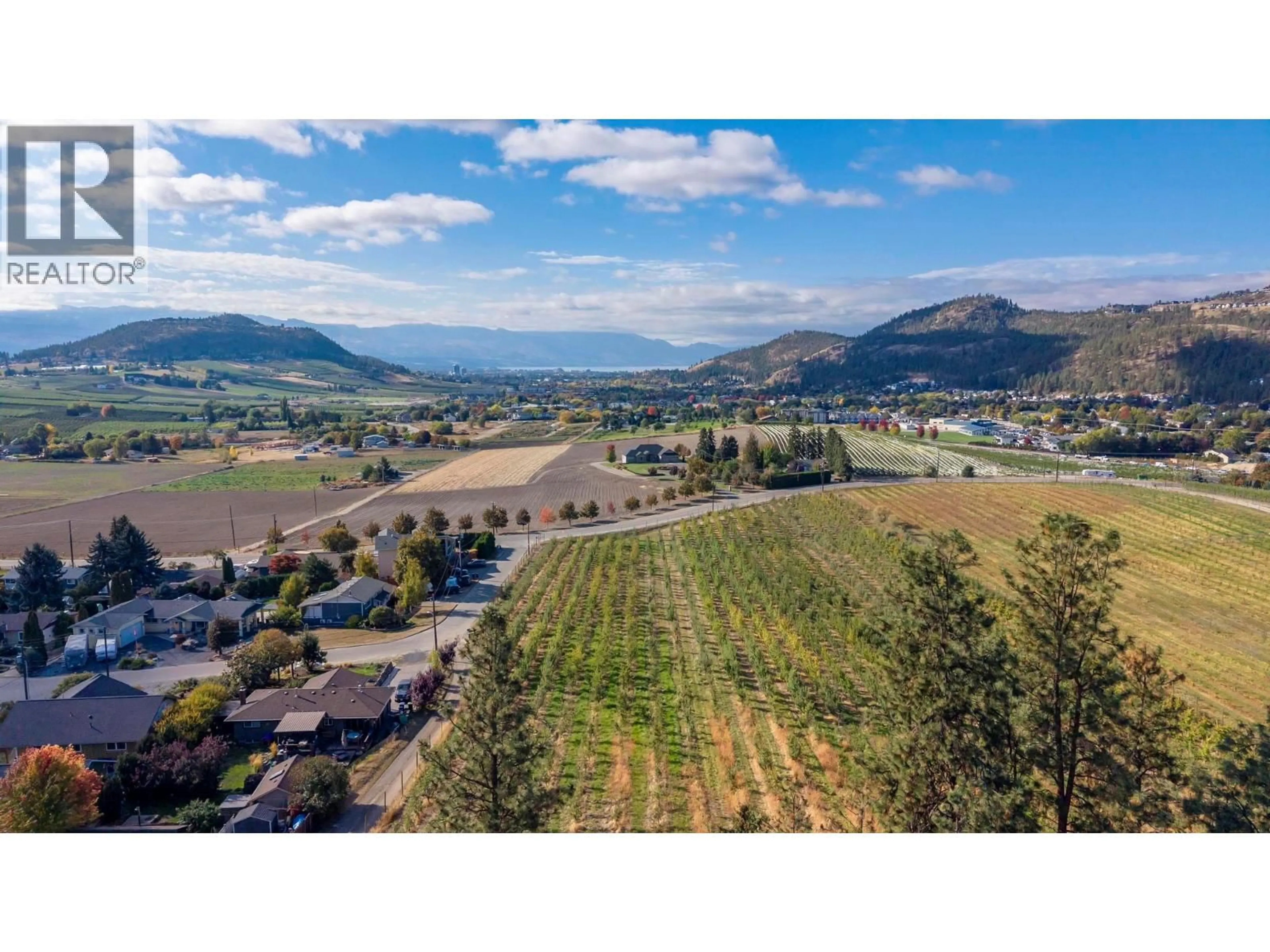 A pic from outside/outdoor area/front of a property/back of a property/a pic from drone, mountain view for 590 BRENDA ROAD, Kelowna British Columbia V1V2C8