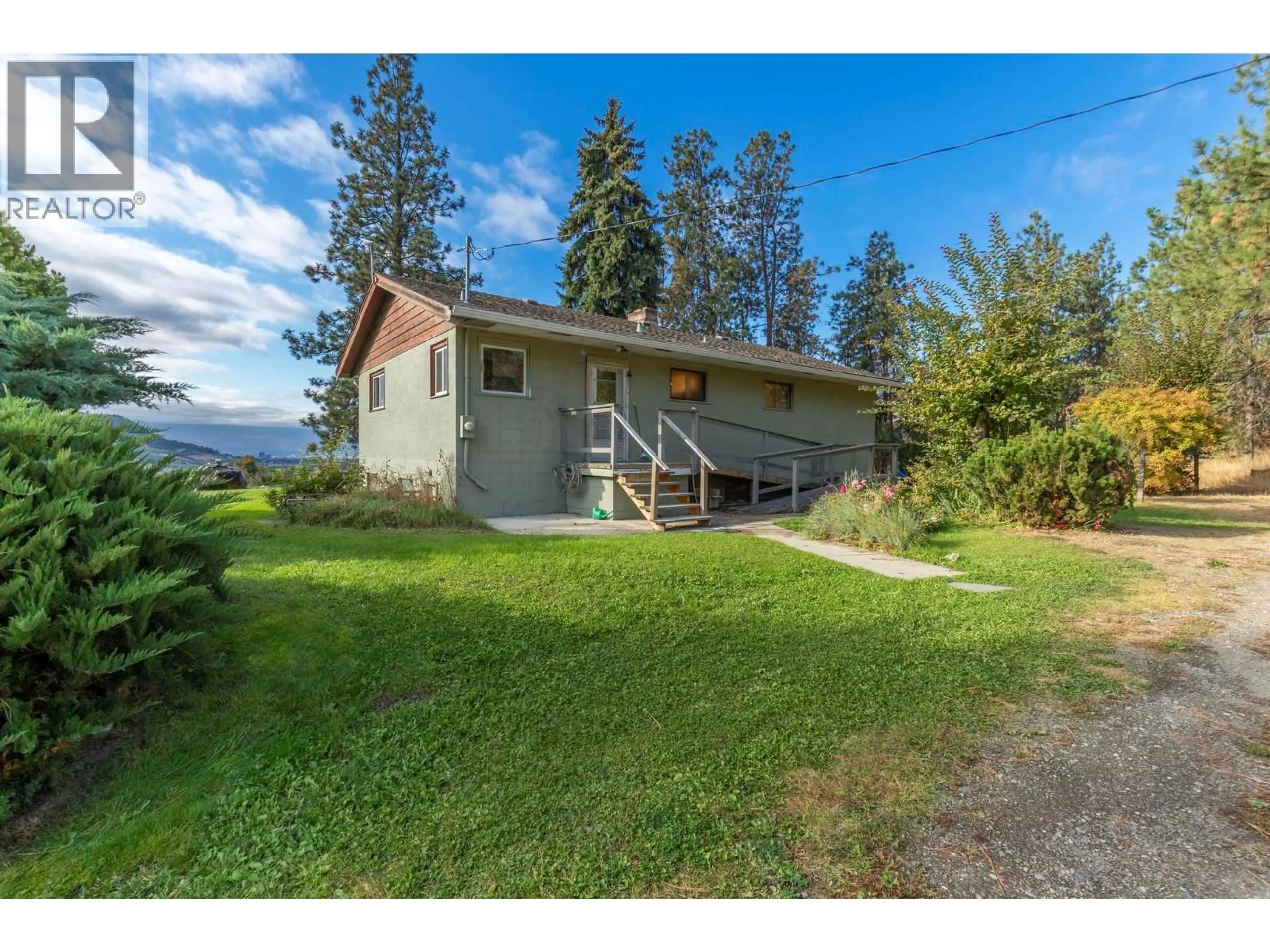 A pic from outside/outdoor area/front of a property/back of a property/a pic from drone, mountain view for 590 BRENDA ROAD, Kelowna British Columbia V1V2C8
