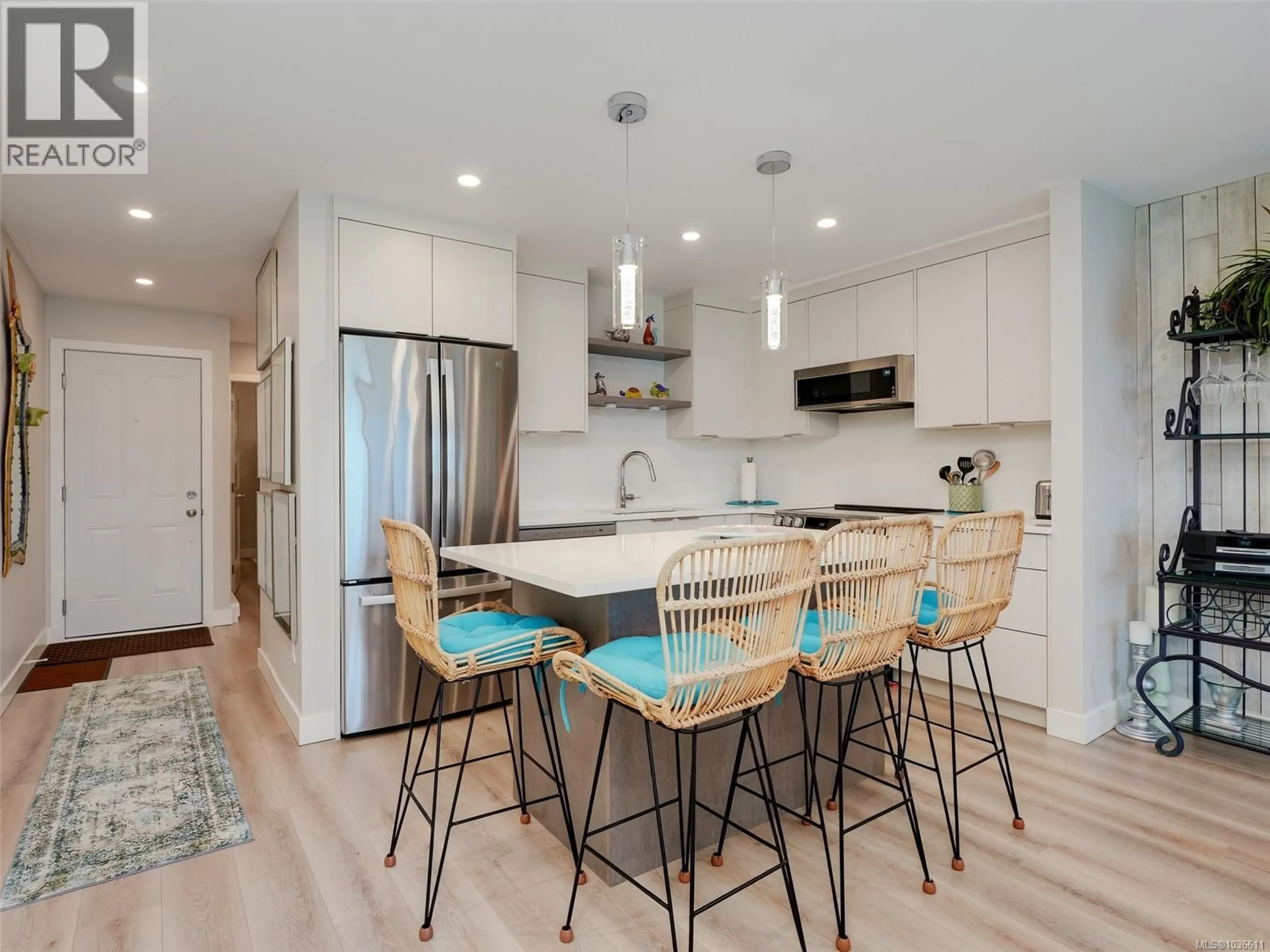 Open concept kitchen, wood/laminate floor for 102 - 2057 KALTASIN ROAD, Sooke British Columbia V9Z0B9