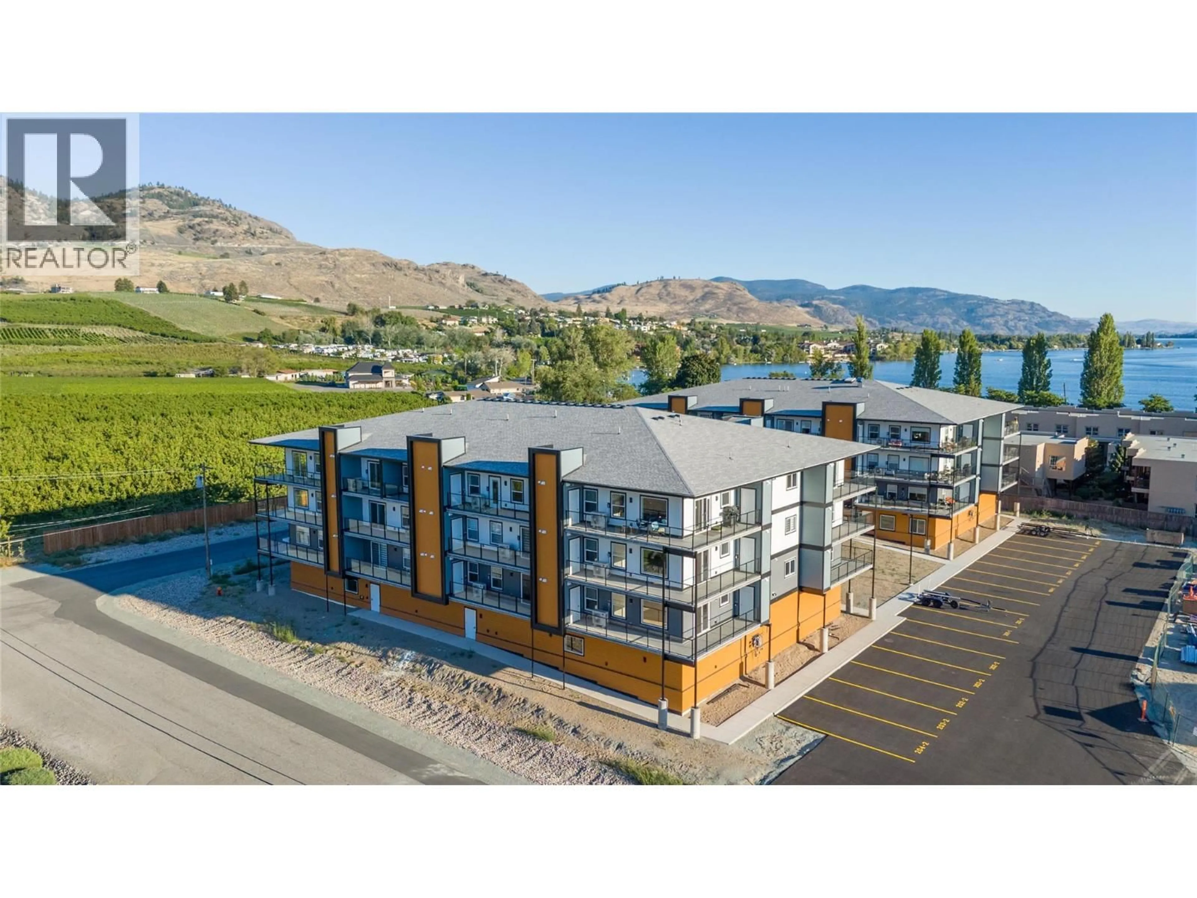 A pic from outside/outdoor area/front of a property/back of a property/a pic from drone, water/lake/river/ocean view for 404 - 5620 51ST STREET, Osoyoos British Columbia V0H1V6