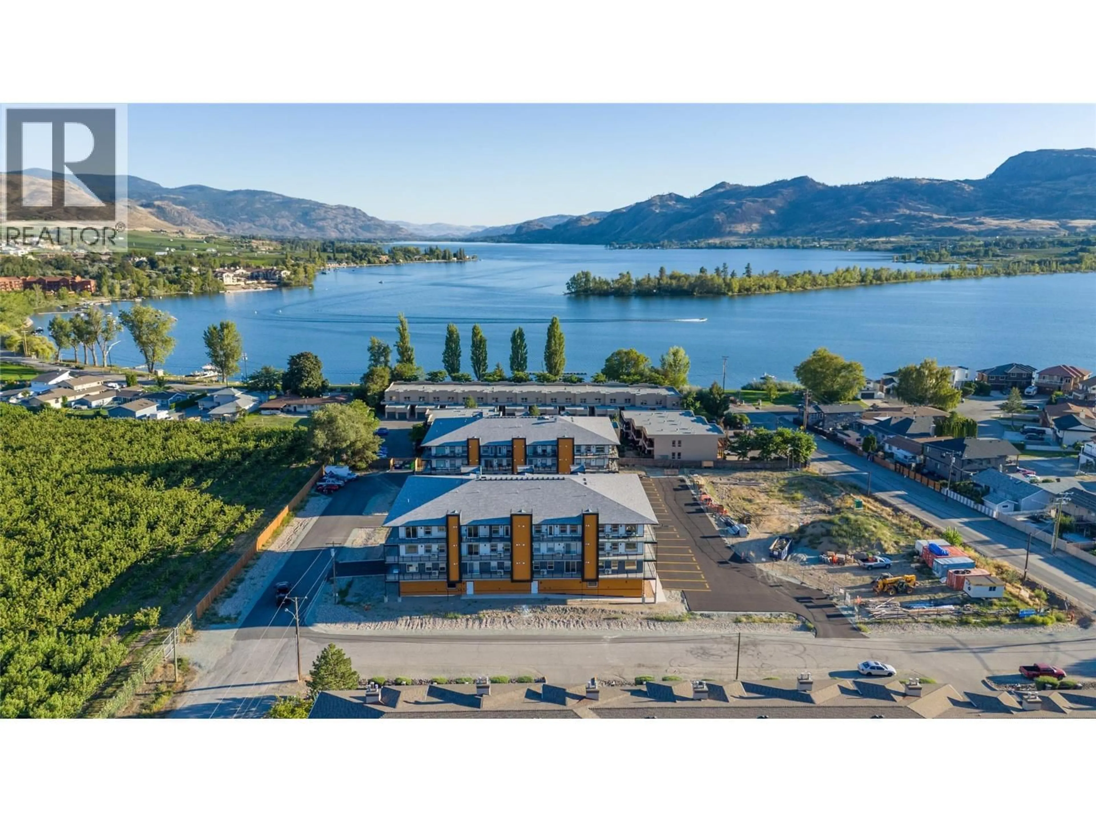 A pic from outside/outdoor area/front of a property/back of a property/a pic from drone, water/lake/river/ocean view for 404 - 5620 51ST STREET, Osoyoos British Columbia V0H1V6