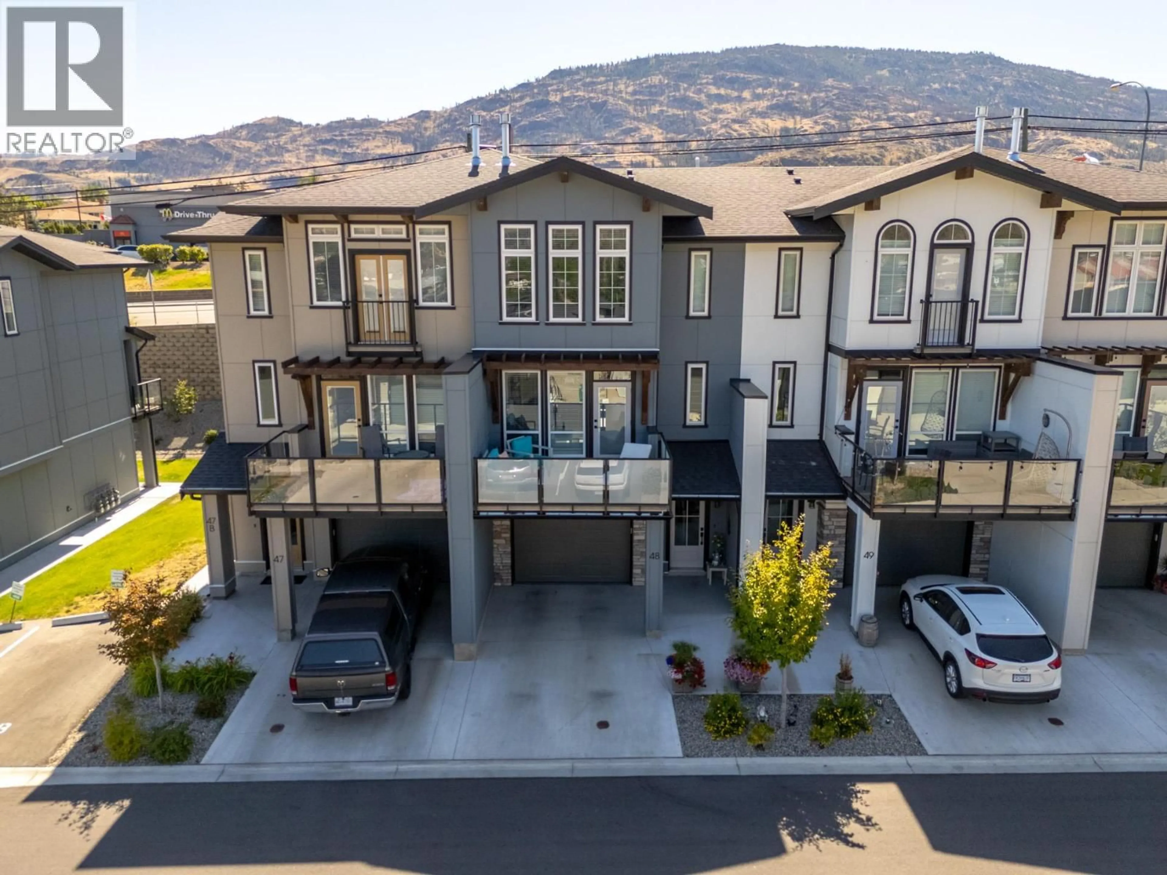 A pic from outside/outdoor area/front of a property/back of a property/a pic from drone, mountain view for 48 - 8000 VEDETTE DRIVE, Osoyoos British Columbia V0H1V2
