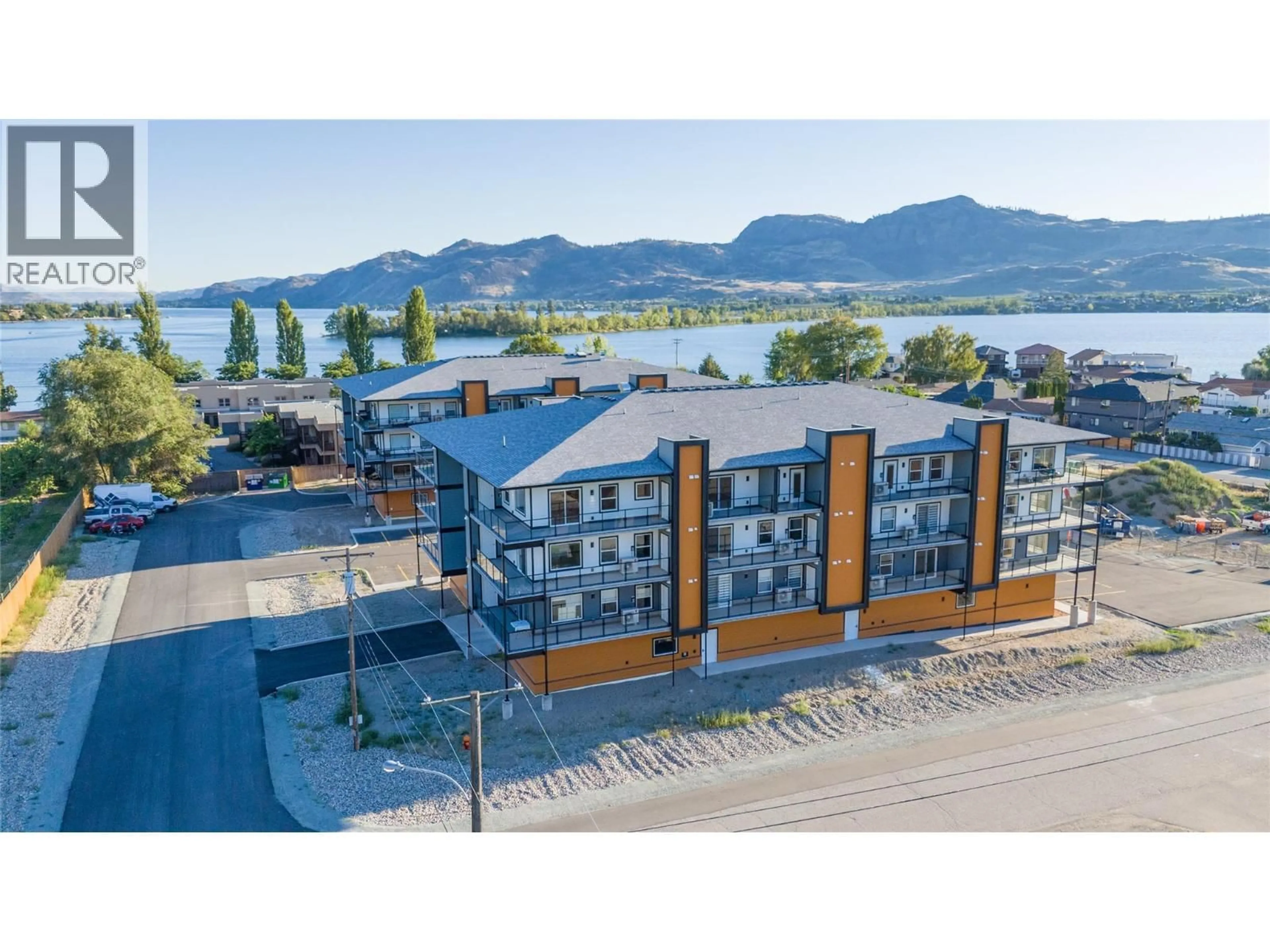 A pic from outside/outdoor area/front of a property/back of a property/a pic from drone, water/lake/river/ocean view for 406 - 5640 51ST STREET, Osoyoos British Columbia V0H1V6