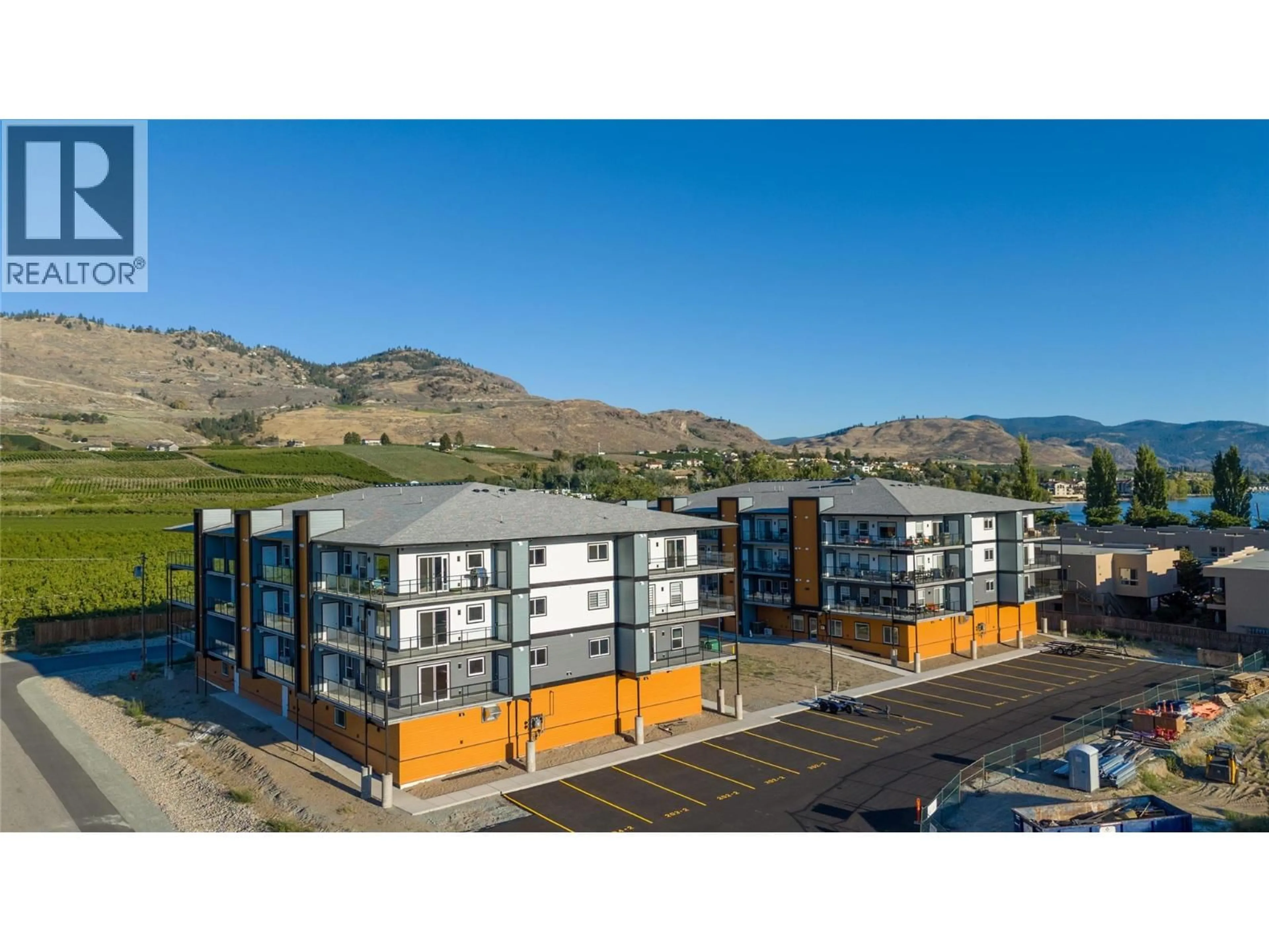 A pic from outside/outdoor area/front of a property/back of a property/a pic from drone, mountain view for 406 - 5640 51ST STREET, Osoyoos British Columbia V0H1V6