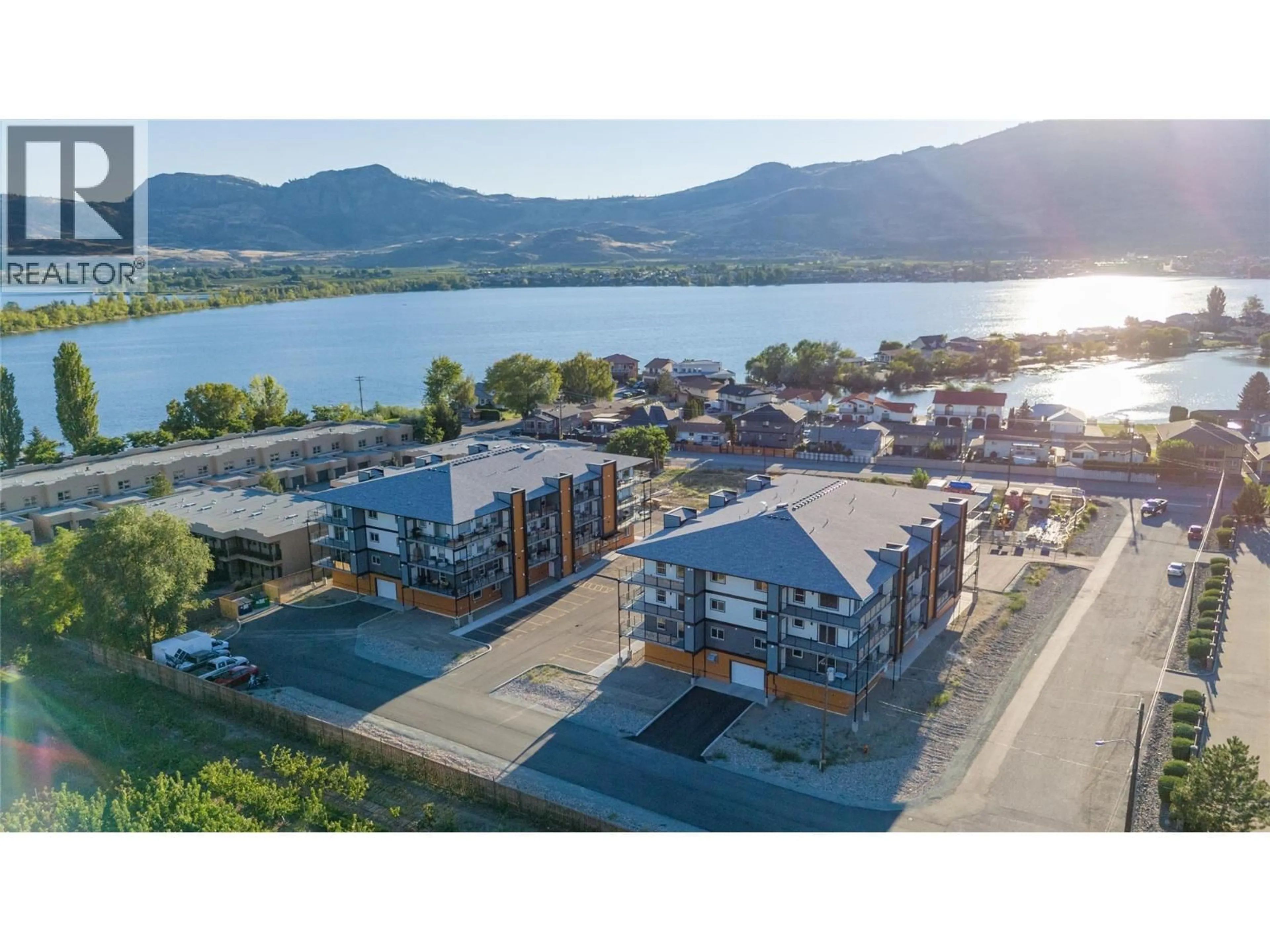 A pic from outside/outdoor area/front of a property/back of a property/a pic from drone, water/lake/river/ocean view for 406 - 5640 51ST STREET, Osoyoos British Columbia V0H1V6