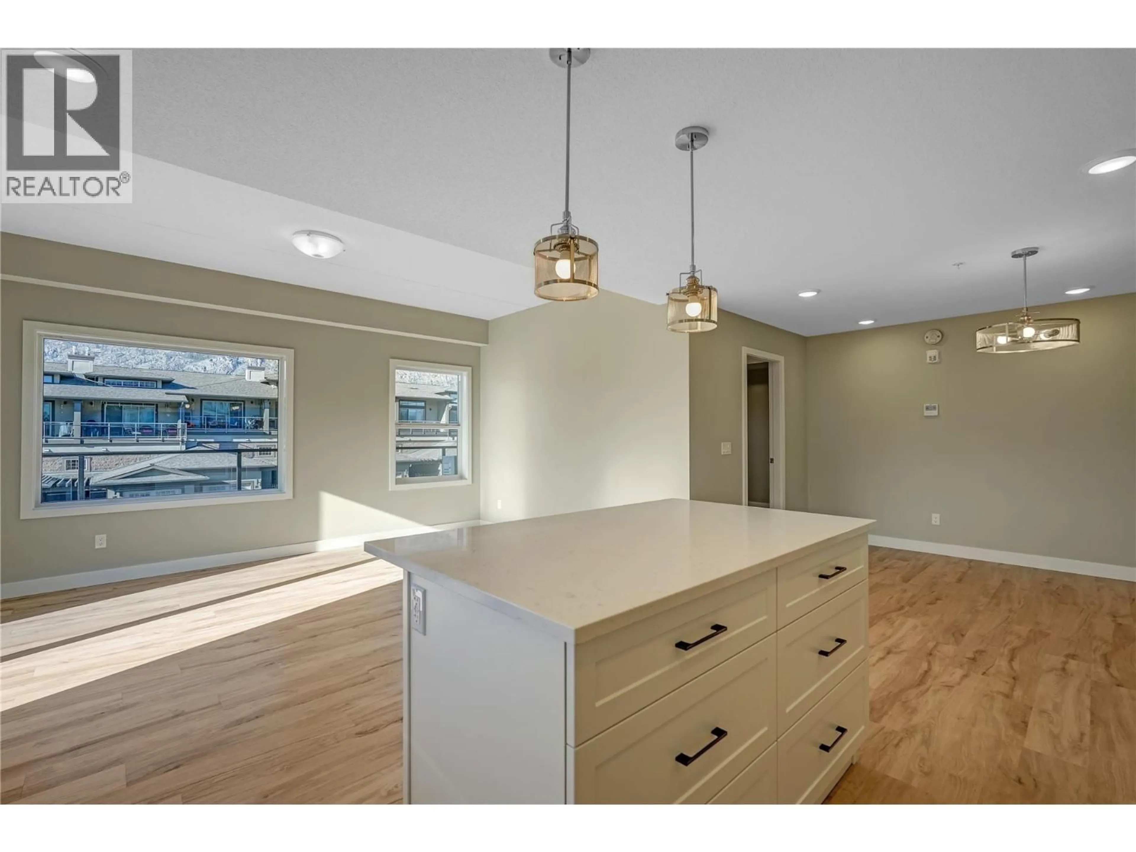 Open concept kitchen, wood/laminate floor for 406 - 5640 51ST STREET, Osoyoos British Columbia V0H1V6
